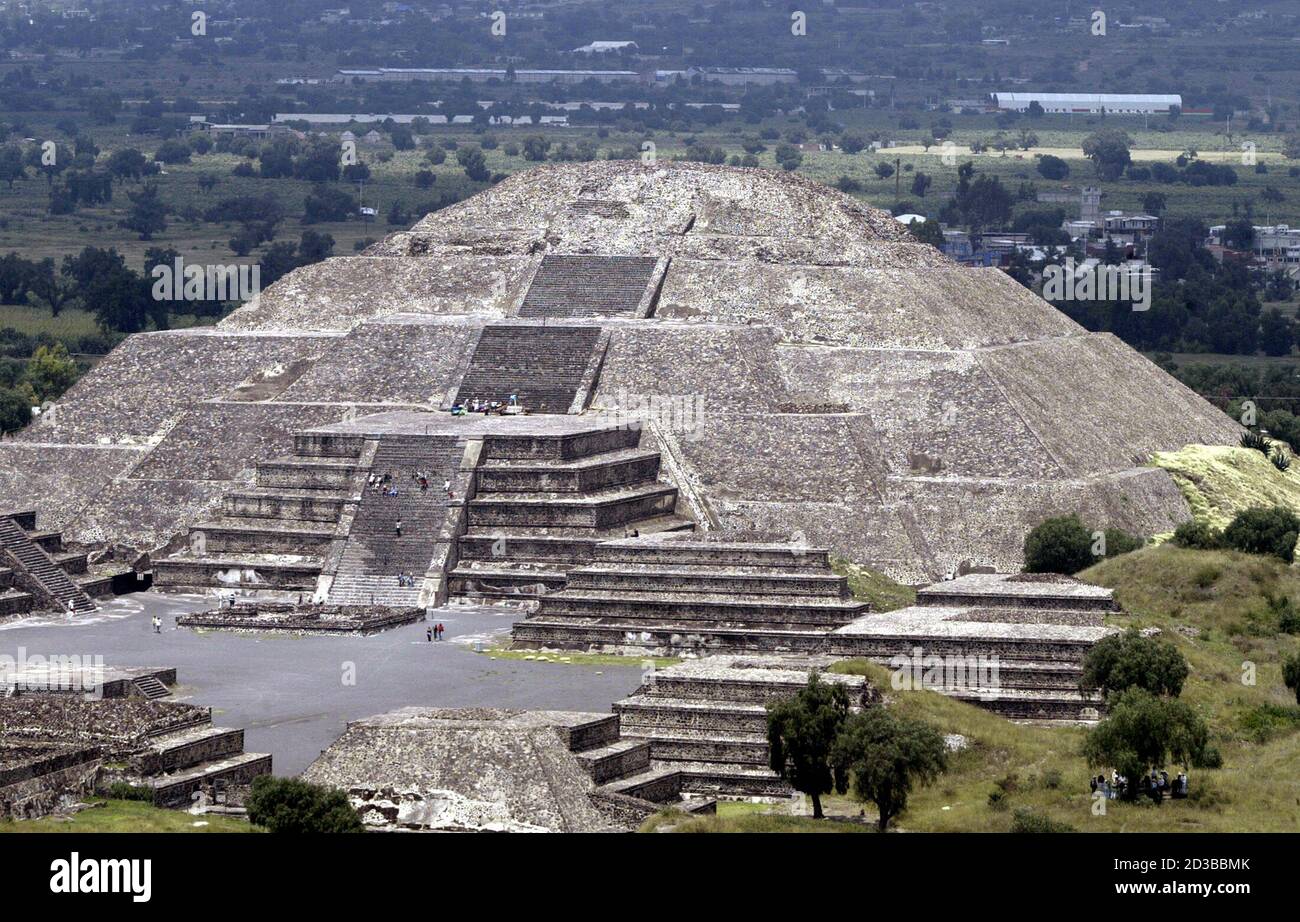 A aerial view of The Pyramid of the Moon at Mexico's Teotihuacan archeological ruins on September 2, 2004. on September 2, 2004. In the shadow of colossal pyramids left by a great Mexican civilization, a Wal-Mart rises, and some locals have gone to court to overturn its approval. Local activists are fighting the warehouse style store, saying it threatens the ruins and will destroy local commerce and a way of life that dates back centuries. Picture taken September 2. Stock Photo
