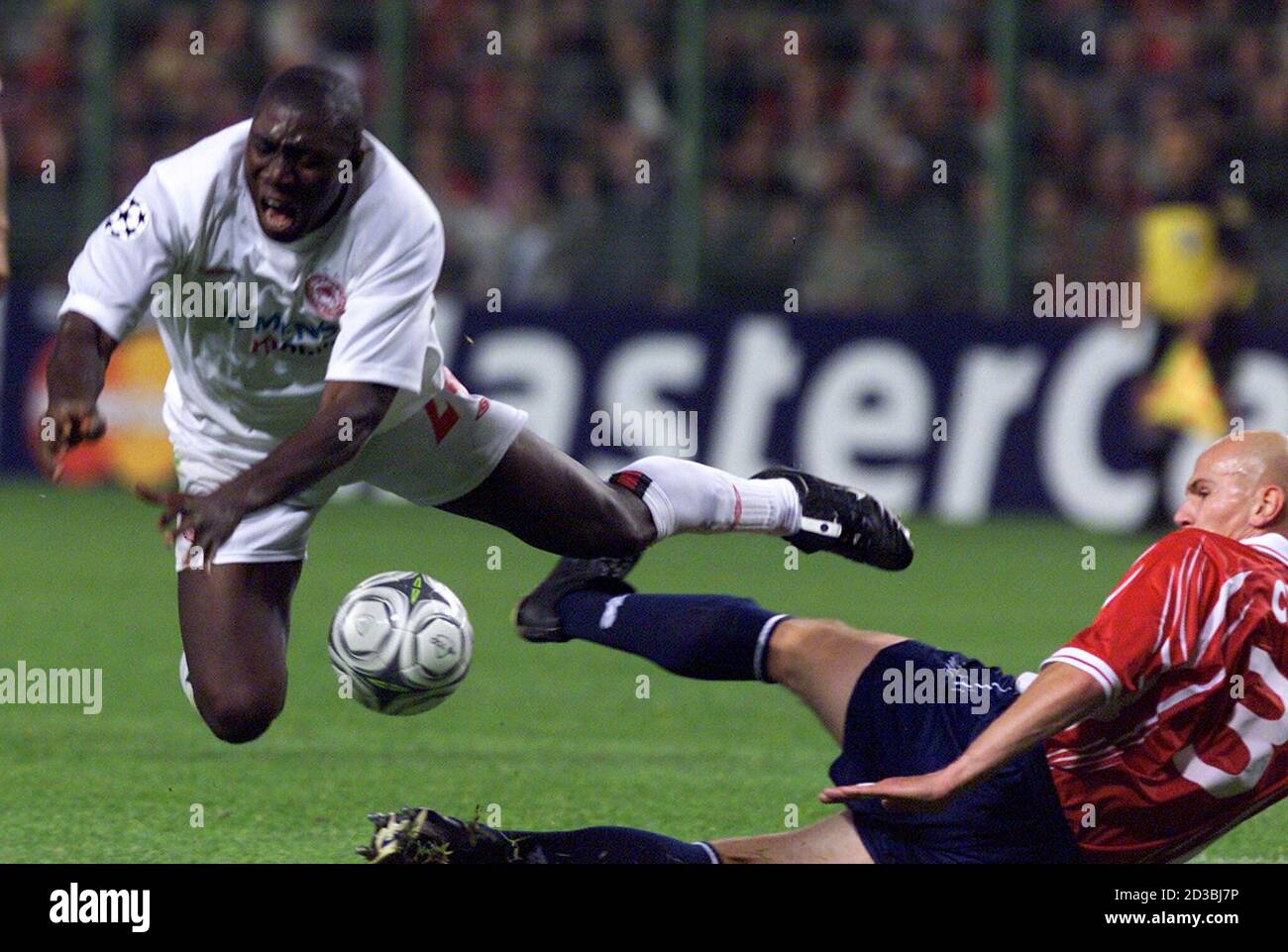 Lille's Pascal Cygan (R) tackles Olympiakos 's Zizi Roberts (L) during  their Champions League Group G match at Bollaert Stadium in Lens, September  25,2001. REUTERS/Pascal Rossignol PR Stock Photo - Alamy