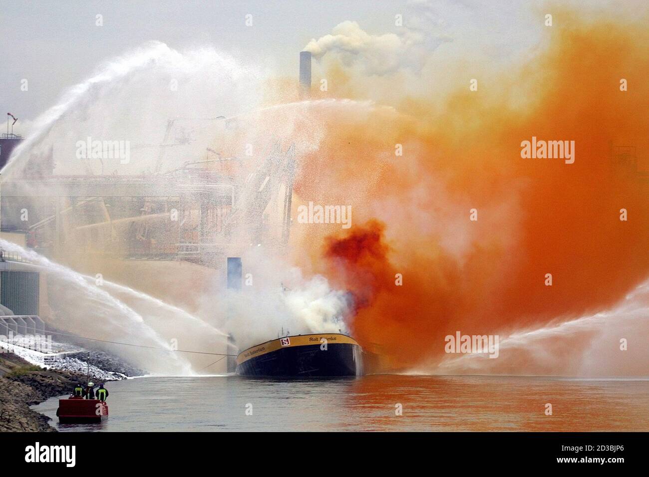 A ship loaded with nitric acid burns in front of the Bayer chemical plant  in Krefeld near Duesseldorf November 21, 2001. The cause of the fire is  unknown, fire-fighters fear the ship