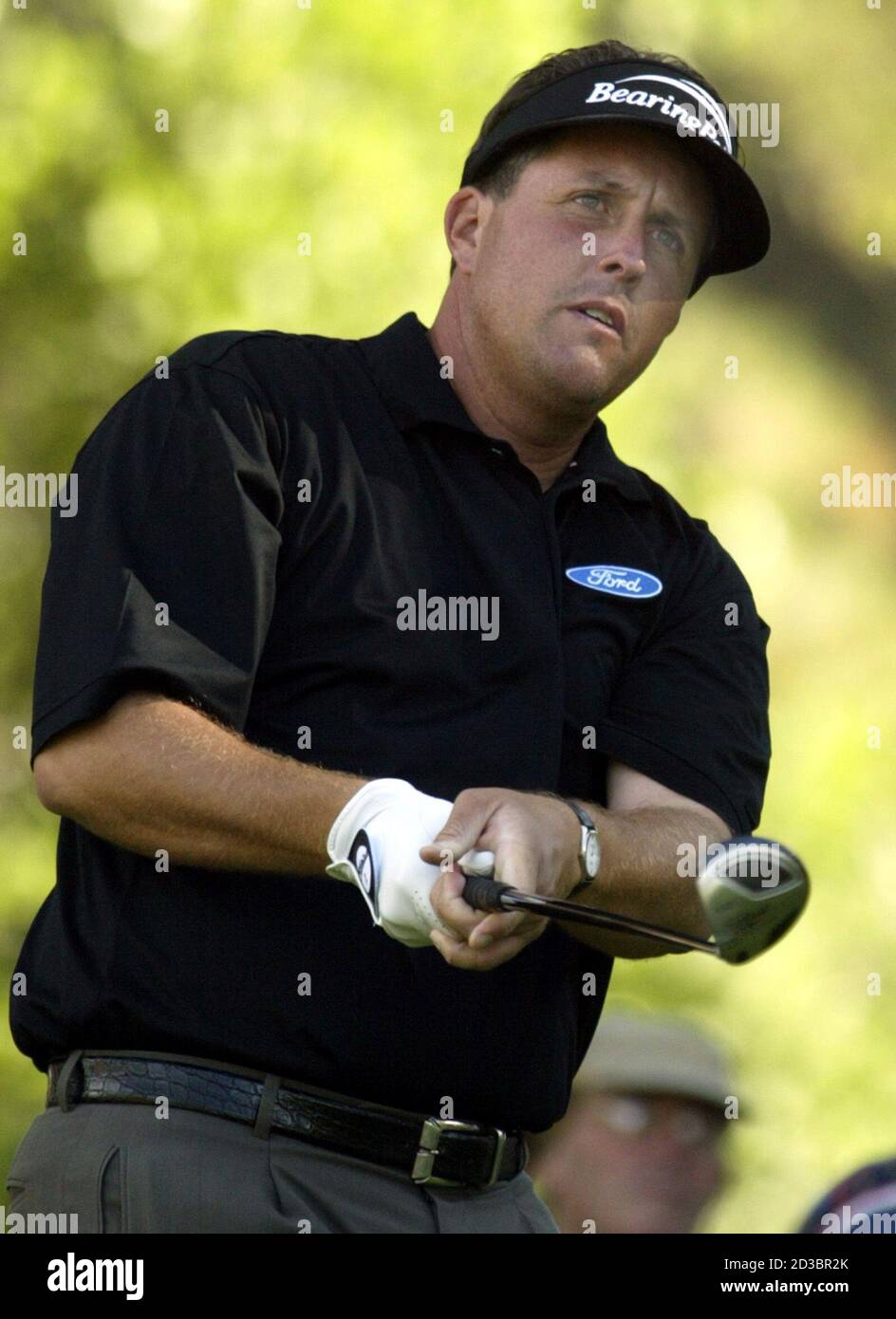 Phil Mickelson watches his tee shot on the 15th hole during the first round of The International, in Castle Rock, Colorado, August 7, 2003. Mickelson has won the International twice in his career, which uses the Modified Stableford scoring system. REUTERS/Gary C. Caskey  GCC/GN Stock Photo