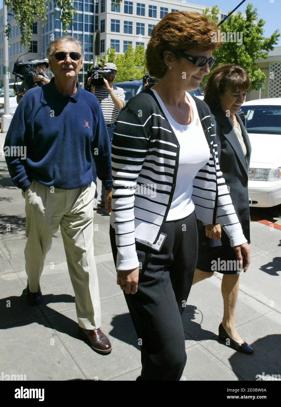 Family members of accused double murderer Scott Peterson, father Lee (L), sister Susan Caudillo (C) and mother Jackie, walk out of the Superior Courts in Redwood City June 1, 2004. Opening statements are to be made on the first day of trial of Scott Peterson who is accused of killing his wife Laci and their unborn son. REUTERS/Kimberly White  KW/GAC Stock Photo