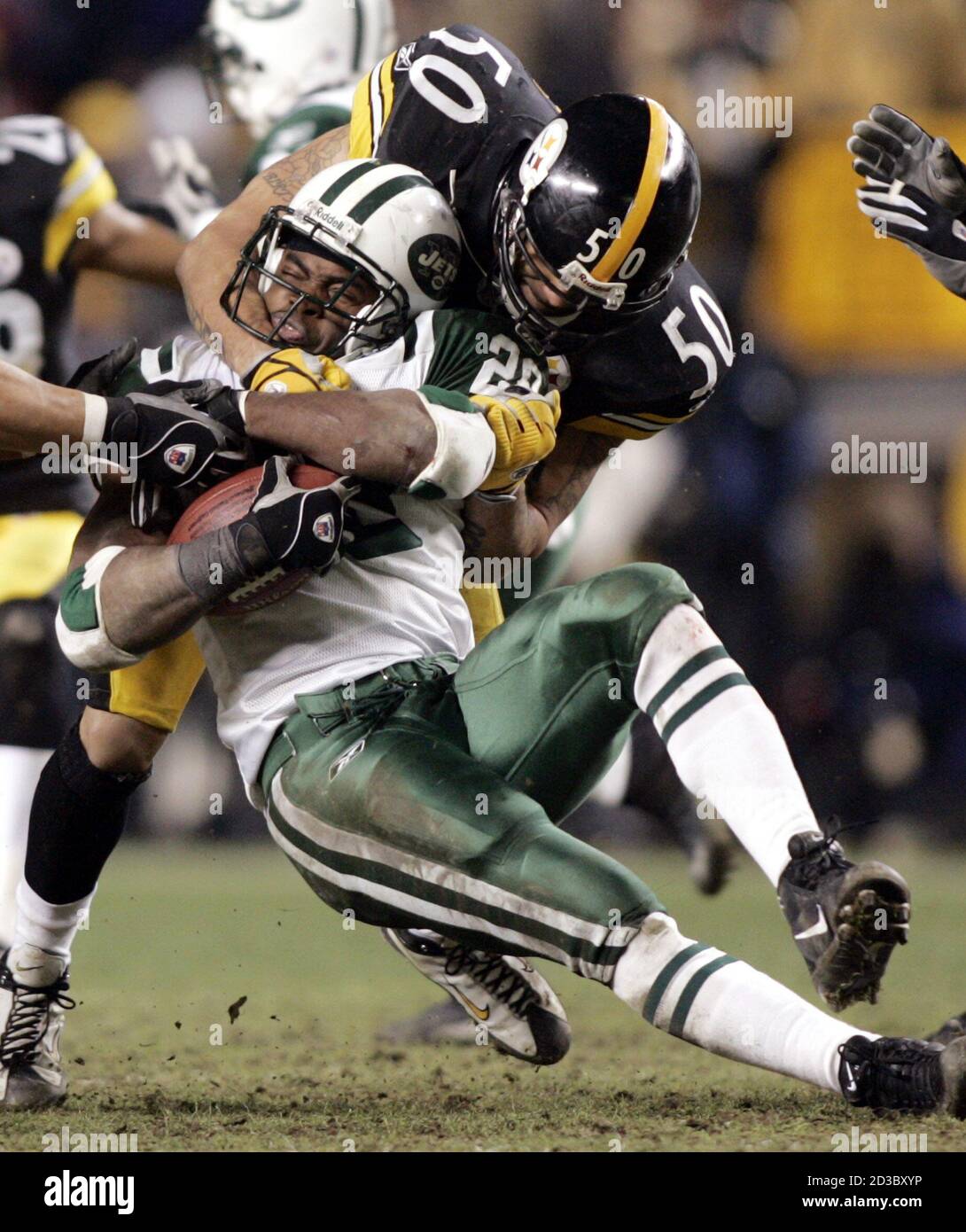New York Jets running back Curtis Martin is tackled by Pittsburgh Steelers  linebacker Larry Foote (50) during their AFC Divisional playoff in  Pittsburgh January 15, 2005. The Steelers defeated the Jets 20-17