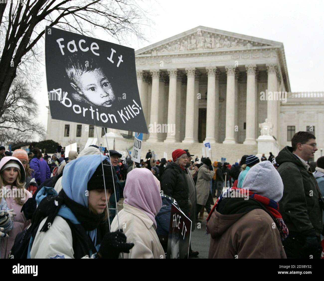 Anti-abortion protestors march outside the U.S. Supreme Court in Washington January 24, 2005, during the 32nd annual March For Life protest against the Supreme Court's 1973 Roe v. Wade abortion rights decision. Thousands of pro-life activists marched to the Supreme Court where they were met by a handful of pro-choice campaigners. REUTERS/Jason Reed  JIR Stock Photo
