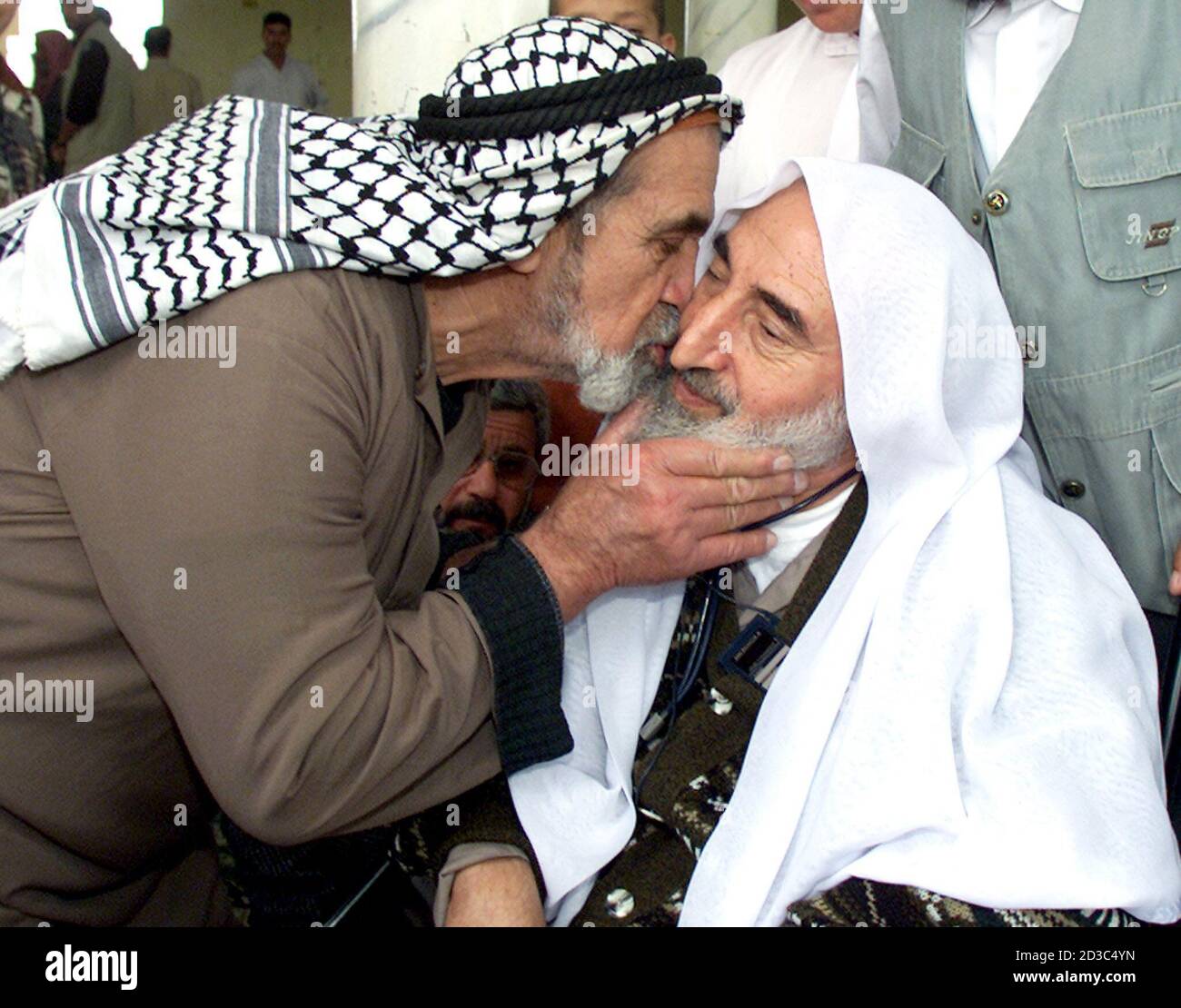 A Palestinian Man Kisses The Founder Of The Islamic Militant Group Hamas Sheikh Ahmed Yassin R In The Mosque After Friday Prayers In Gaza May 17 2002 Yassin Vowed His Movement Would Continue