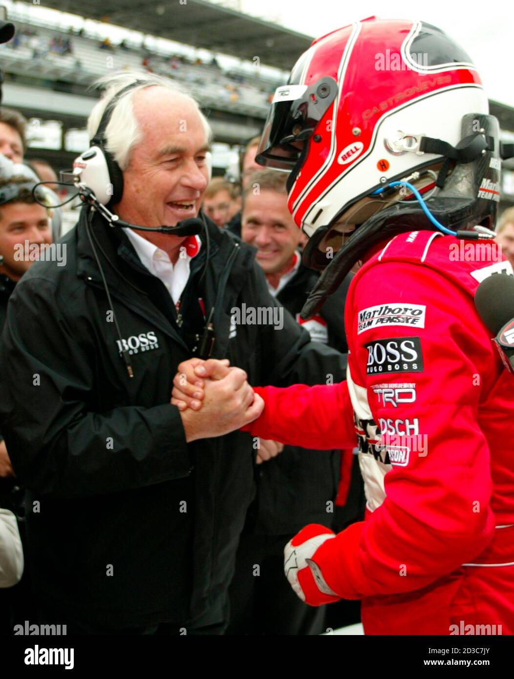 Team Penske owner Roger Penske (L 