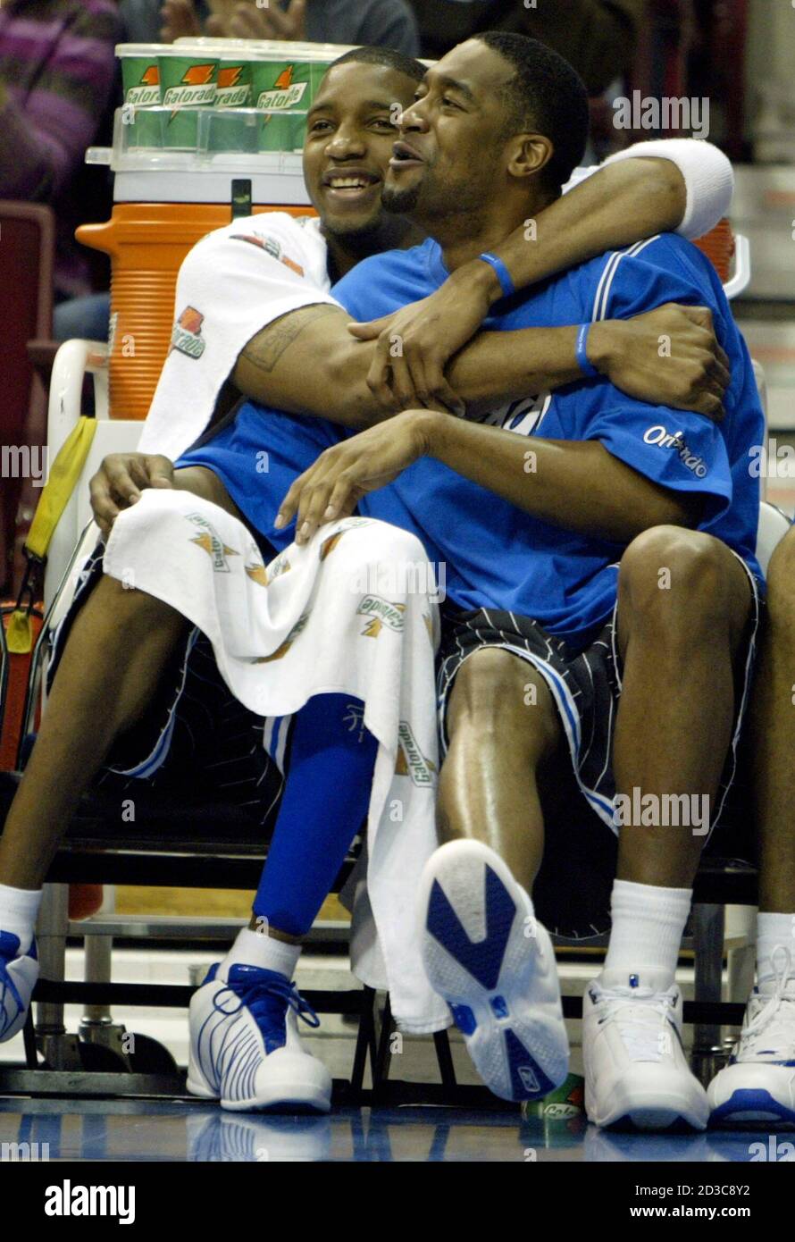 Orlando Magic guard Tracy McGrady (L) and forward Lee Nailon celebrate as  they watch their teammates in action against the Washington Wizards, during  first half of their NBA game in Orlando, January