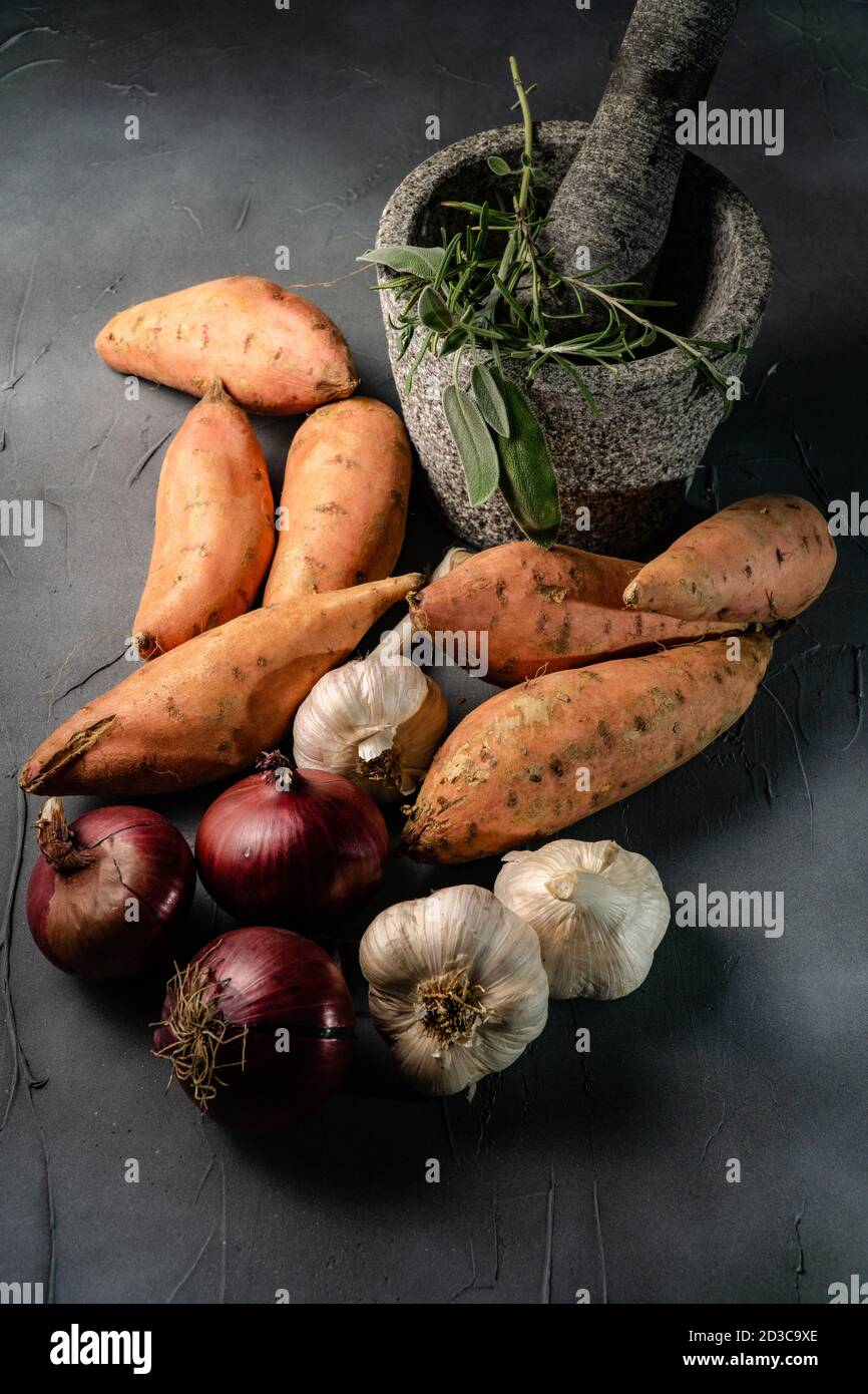 sweet potato, red onion and garlic Stock Photo Alamy