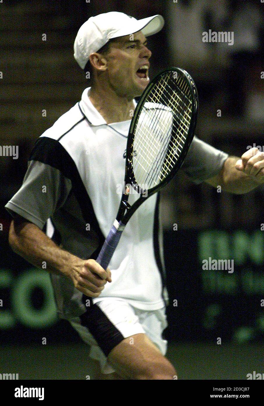 Zimbabwean tennis player Byron Black celebrates his win against Belarus's  Maxim Mirnyi during the final day of the Davis Cup tie in Harare April 7,  2002. Black won the match 3-1 (6-3
