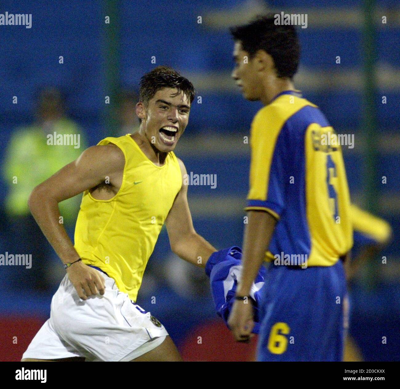 Brazilian Jean Carlos Donde runs past Colombian Andres Felipe Gonzalez  after he scored his team's third goal during the second half of their  second round Under 20 South American soccer match, in