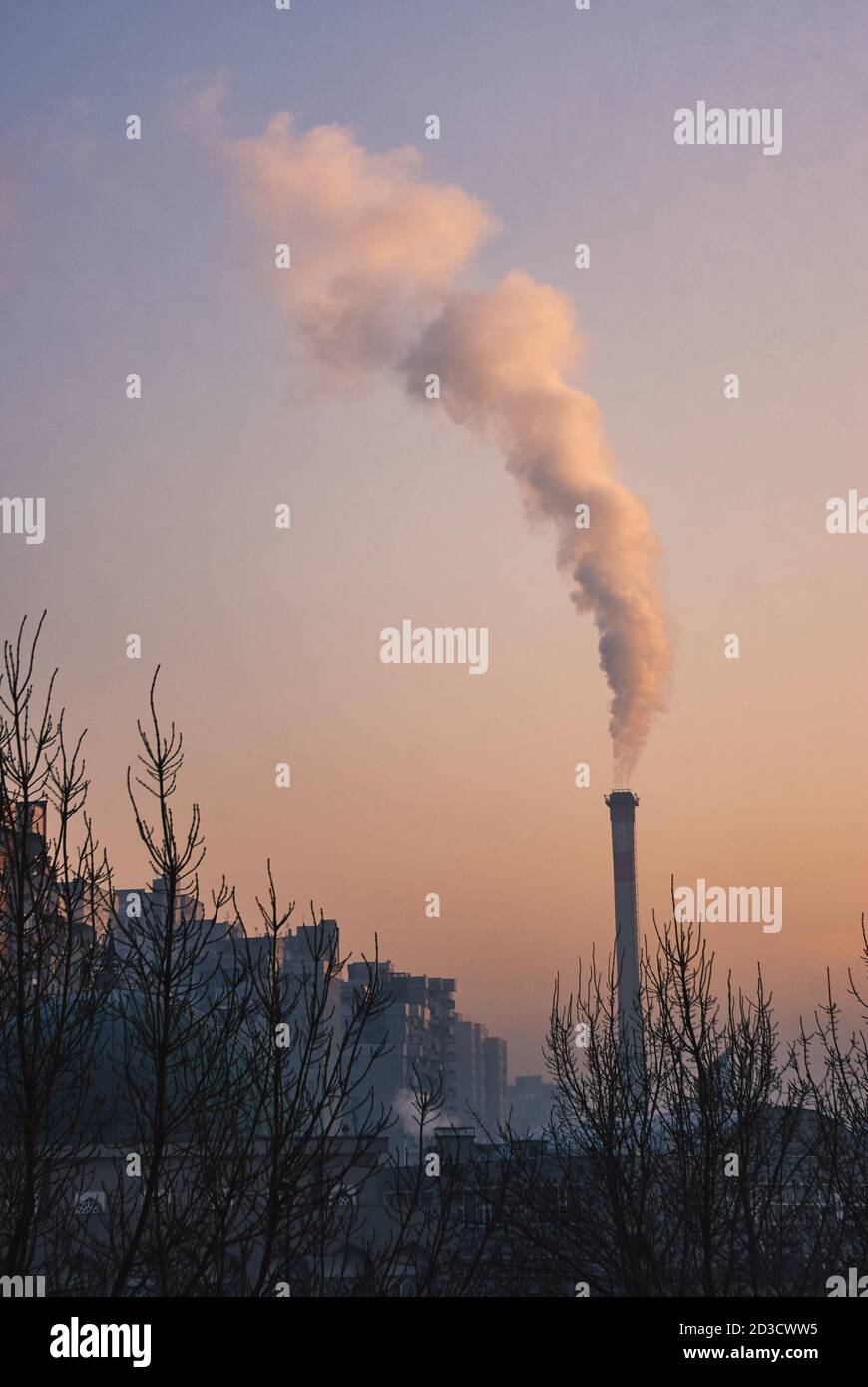 Fume smoke comes out of the chimney. Sky and air pollution at winter season Stock Photo Alamy