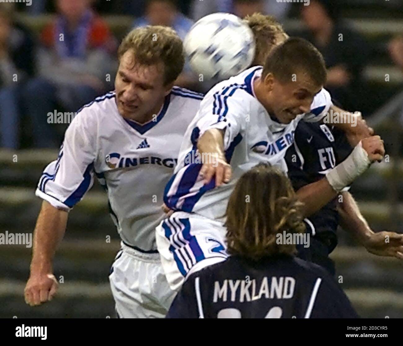 Harald Cerny (rear) of TSV 1860 Munich heads for the ball with Tuma Vitezslav (L) and Lubomir Kubica (R) of FK Drnovice during the first half of their Uefa Cup soccer match in Munich's Olympic stadium, September 26, 2000. Munich's Erik Mykland is in the foreground.  MAD Stock Photo
