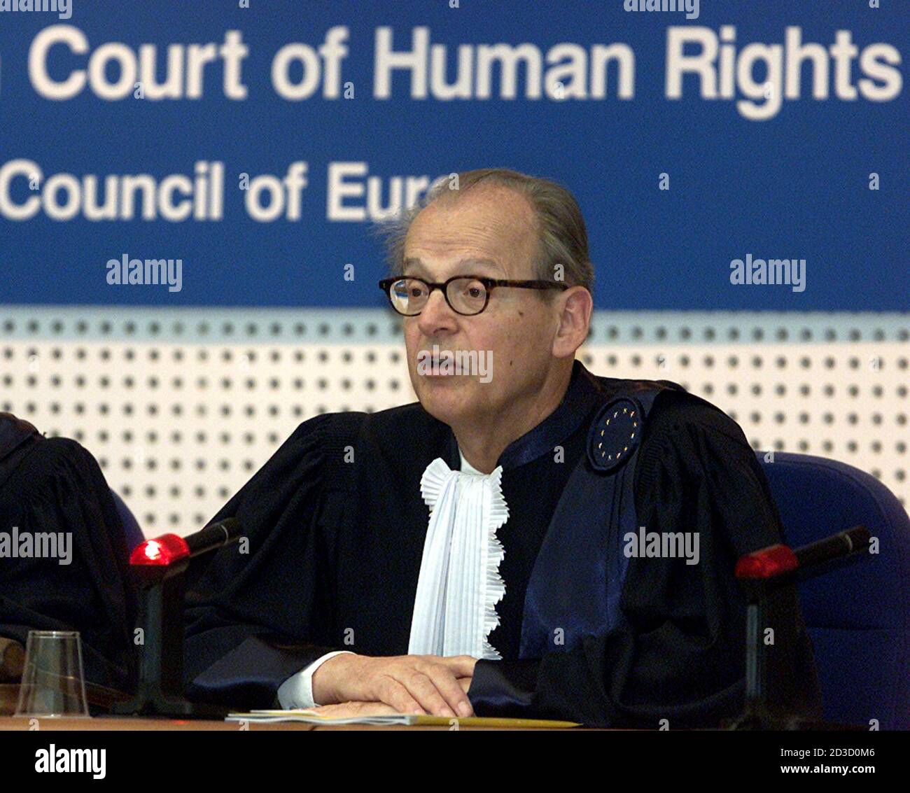 SWISS PRESIDENT OF STRASBOURG'S HUMAN RIGHTS COURT LUZUIS WILHDABER DISPENSES THE JUDGMENT IN EST GERMAN LAST COMMUNIST LEADER EGON KRENZ.   Swiss President of the European Court of Human Rights Luzius Wildhaber dispenses the judgements in the case of East Germany's last Communist leader Egon Krenz and three other former East German communists in Strasbourg March 22, 2001. The European Court of Human Rights rejected Krenz's appeal against manslaughter conviction for cold war-era shootings along the Berlin Wall and said he should serve his six and a half years jail sentence. Stock Photo