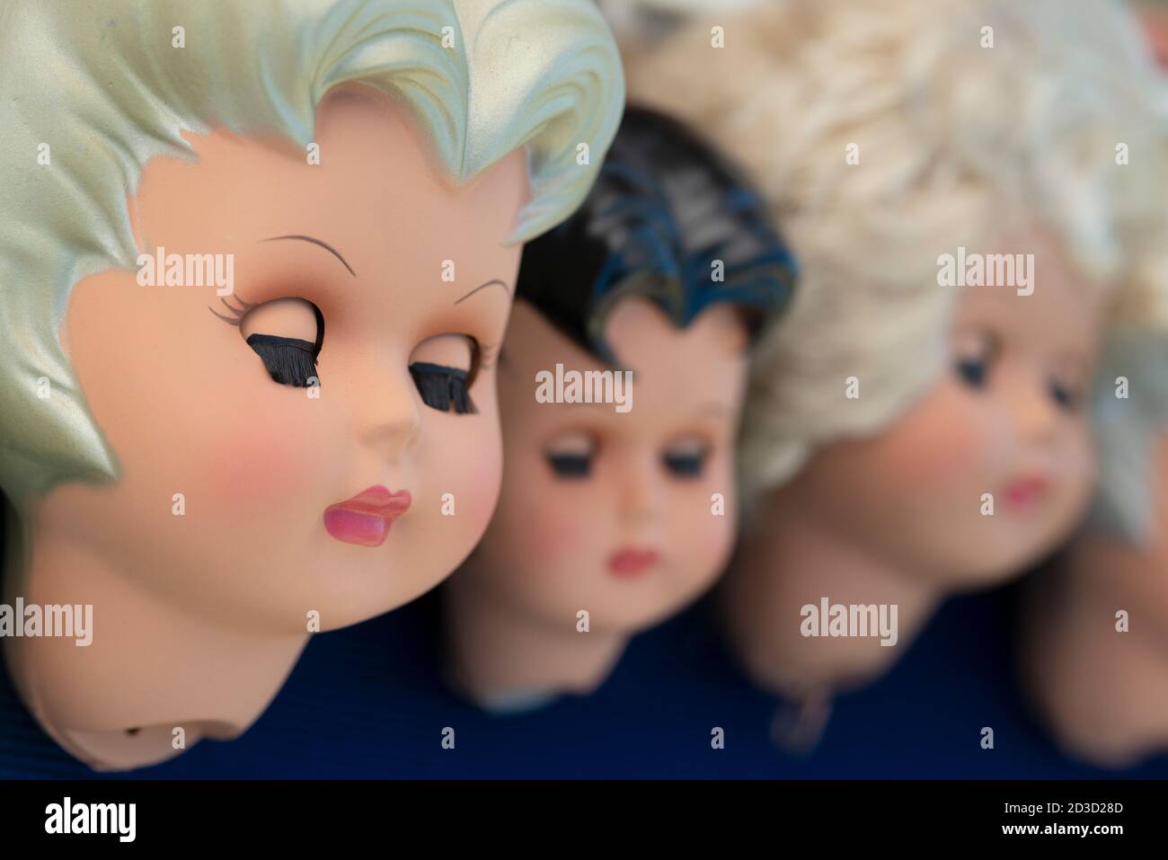 Heads Of Plastic Dolls With Closed Eyes Stock Photo Alamy