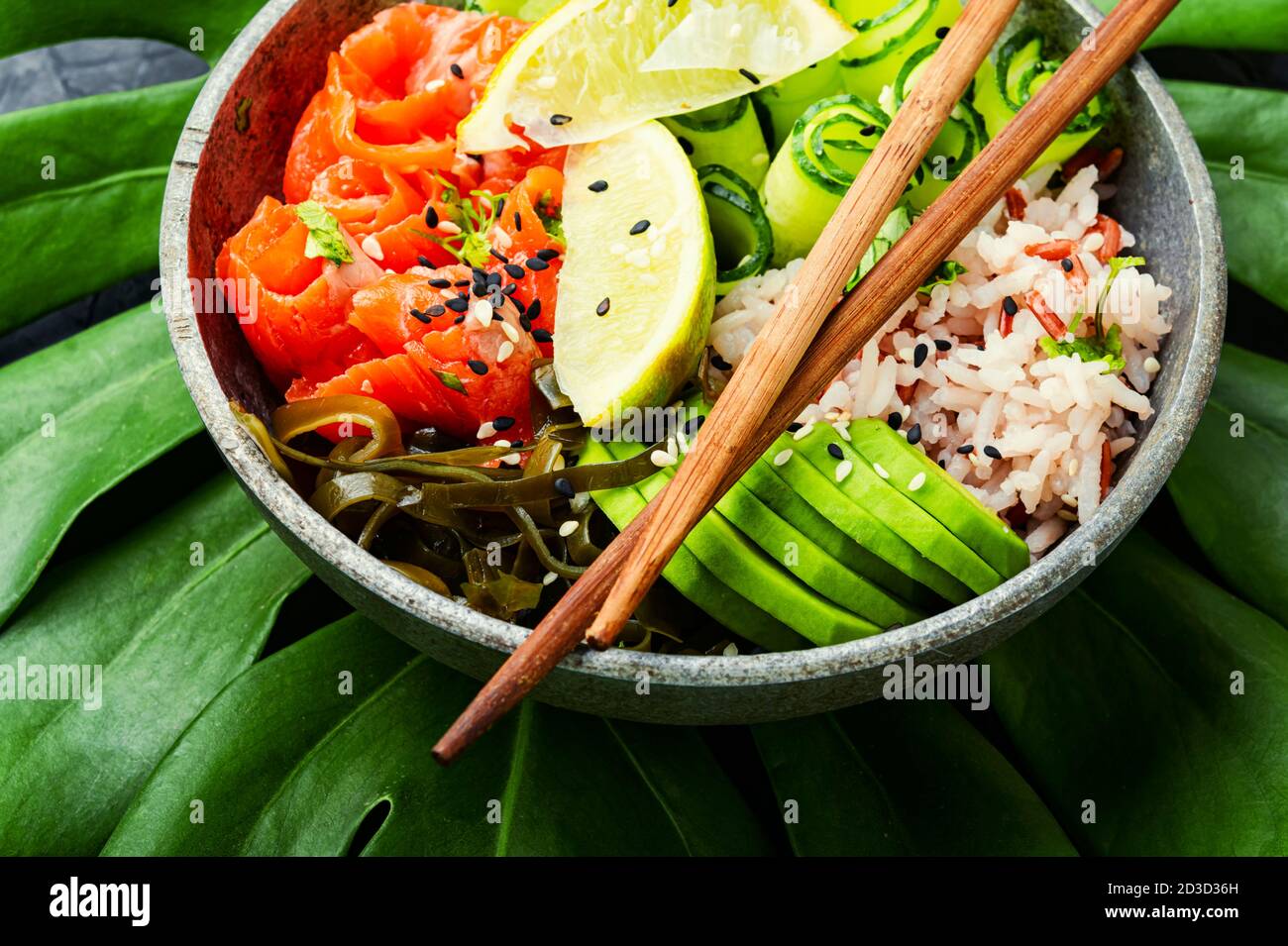 Hawaiian salmon poke bowl with rice,seaweed and avocado Stock Photo Alamy