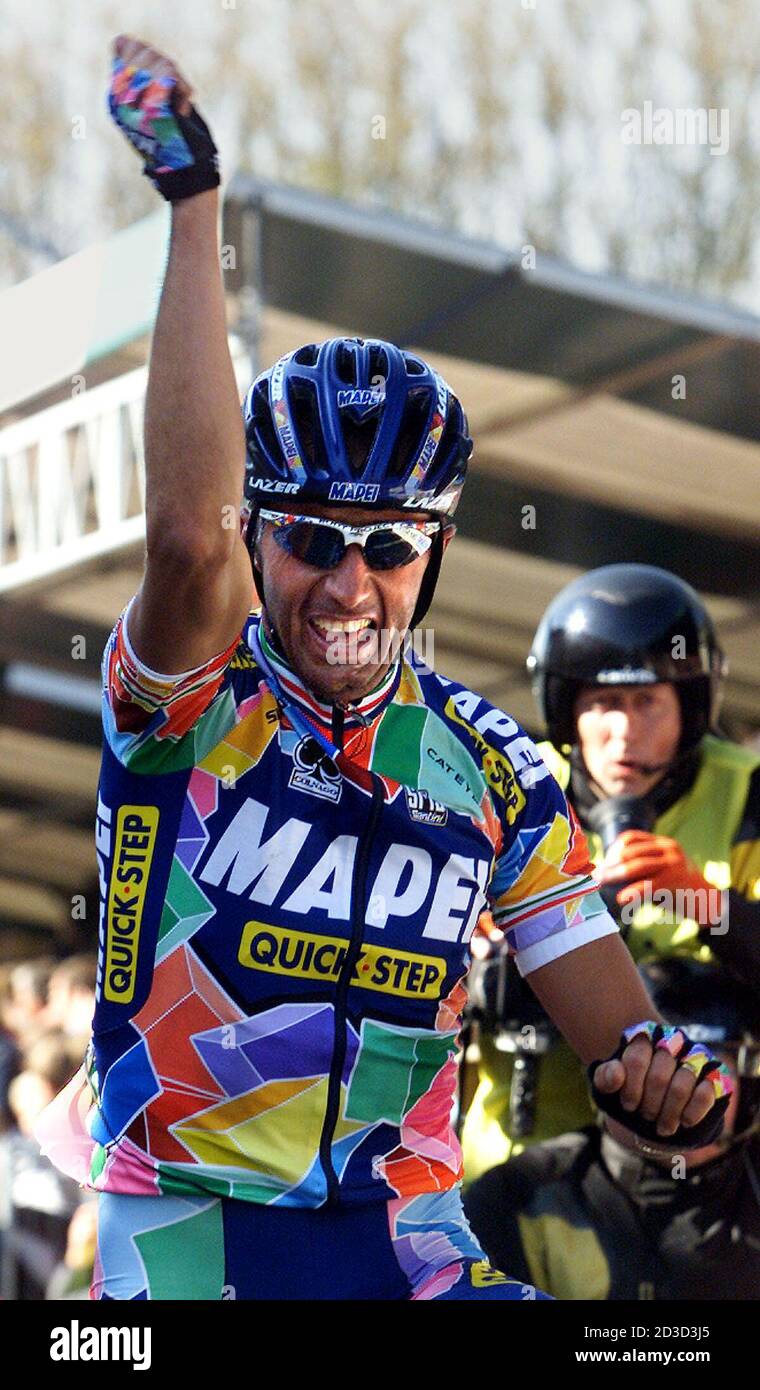 Italian Andrea Tafi raises his arms in victory as he wins the World Cup  Ronde Van Vlaanderen/Tour of Flanders cycling race in Meerbeke April 7,  2002. Tafi won the 264-km race ahead