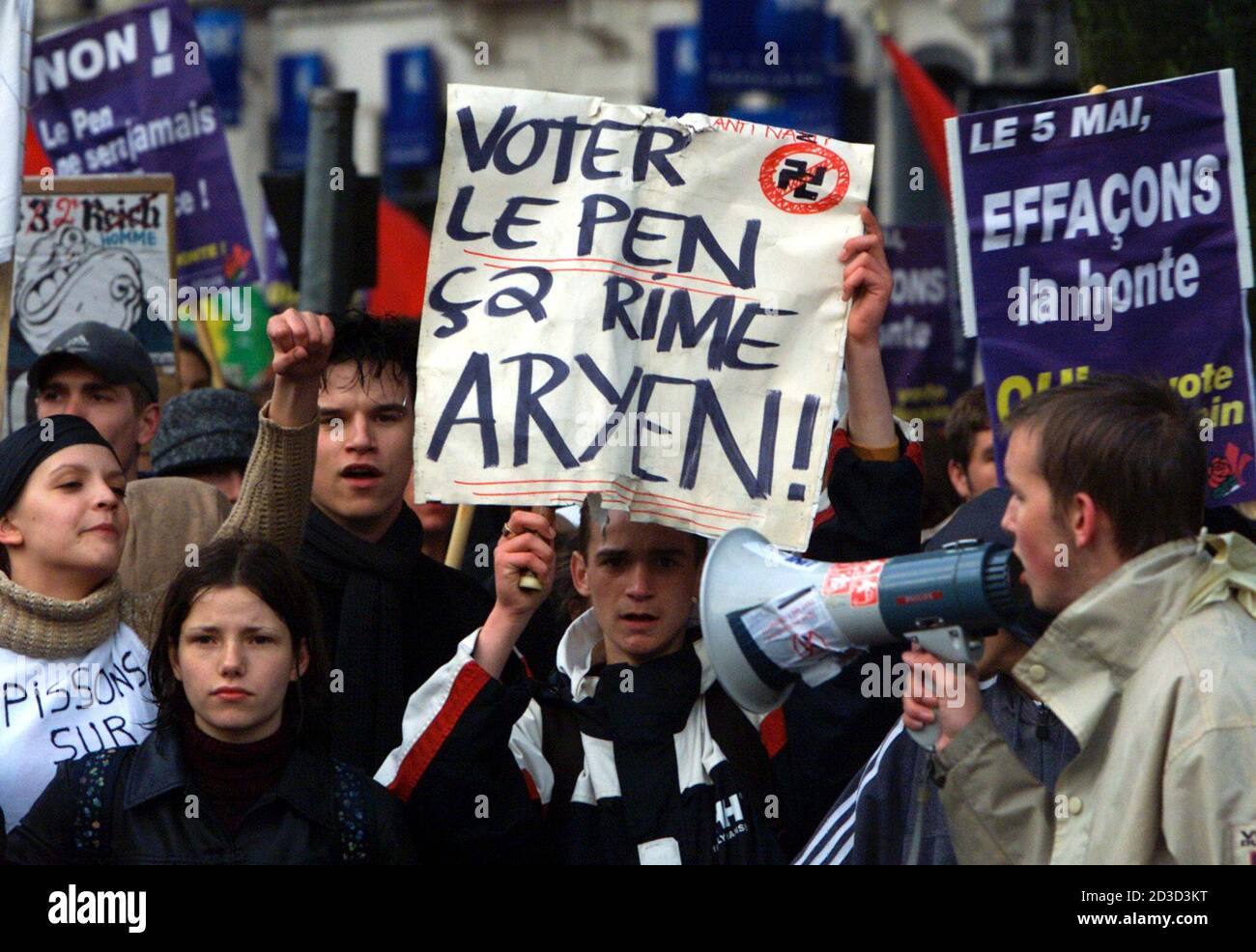 Demonstrators With Anti Fn Pancarts Which Reads Wash The Shame Vote Le Pen Is Like Vote Aryen As She Shouts Slogans Against National Front Presidential Candidate Jean Marie Le Pen In Lille