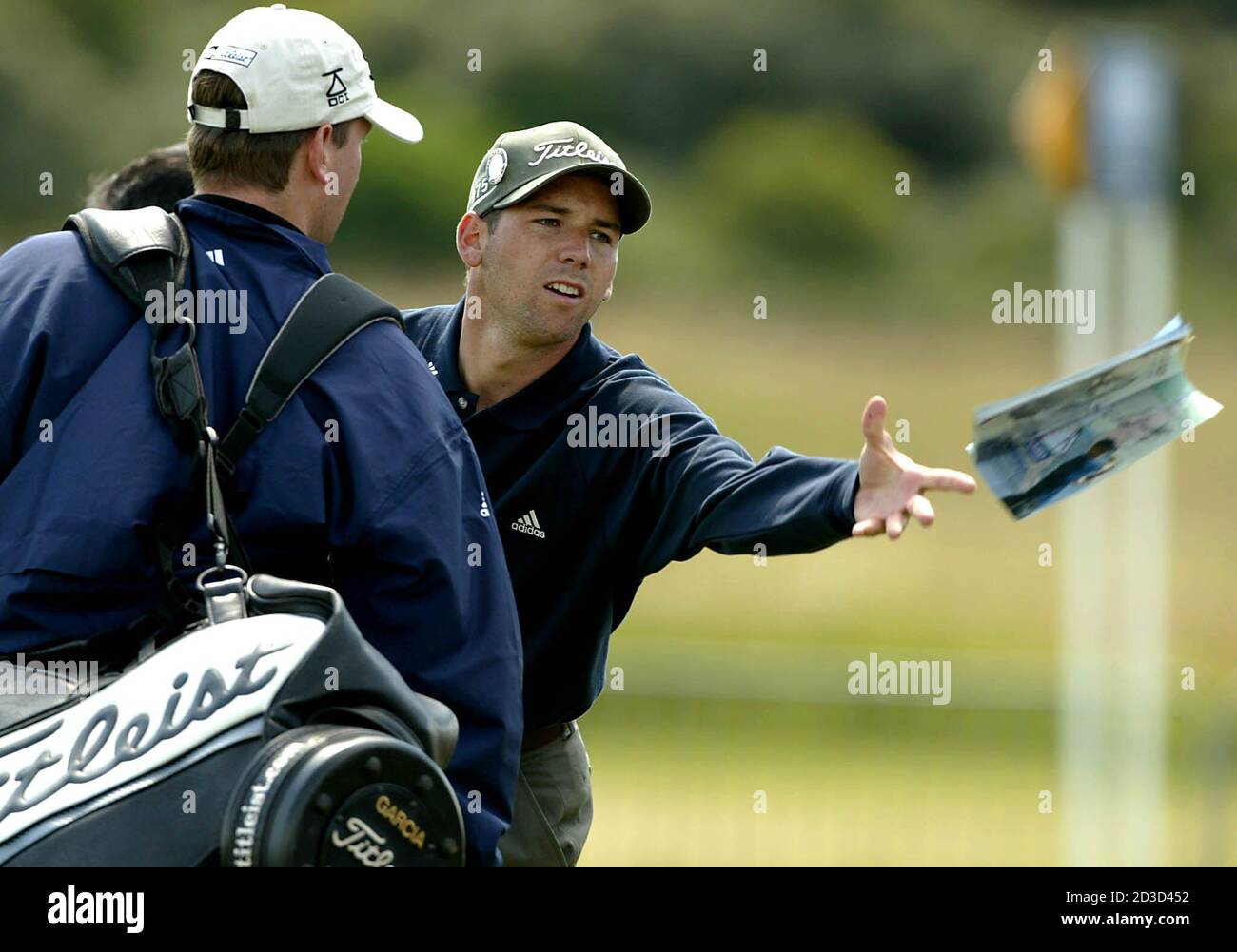 Spanish golfer Sergio Garcia throws a programe to an autograph hunter  during his practice round for the British Open Golf Championship at  Muirfield in Scotland, July15, 2002. The 131st Open Championship starts