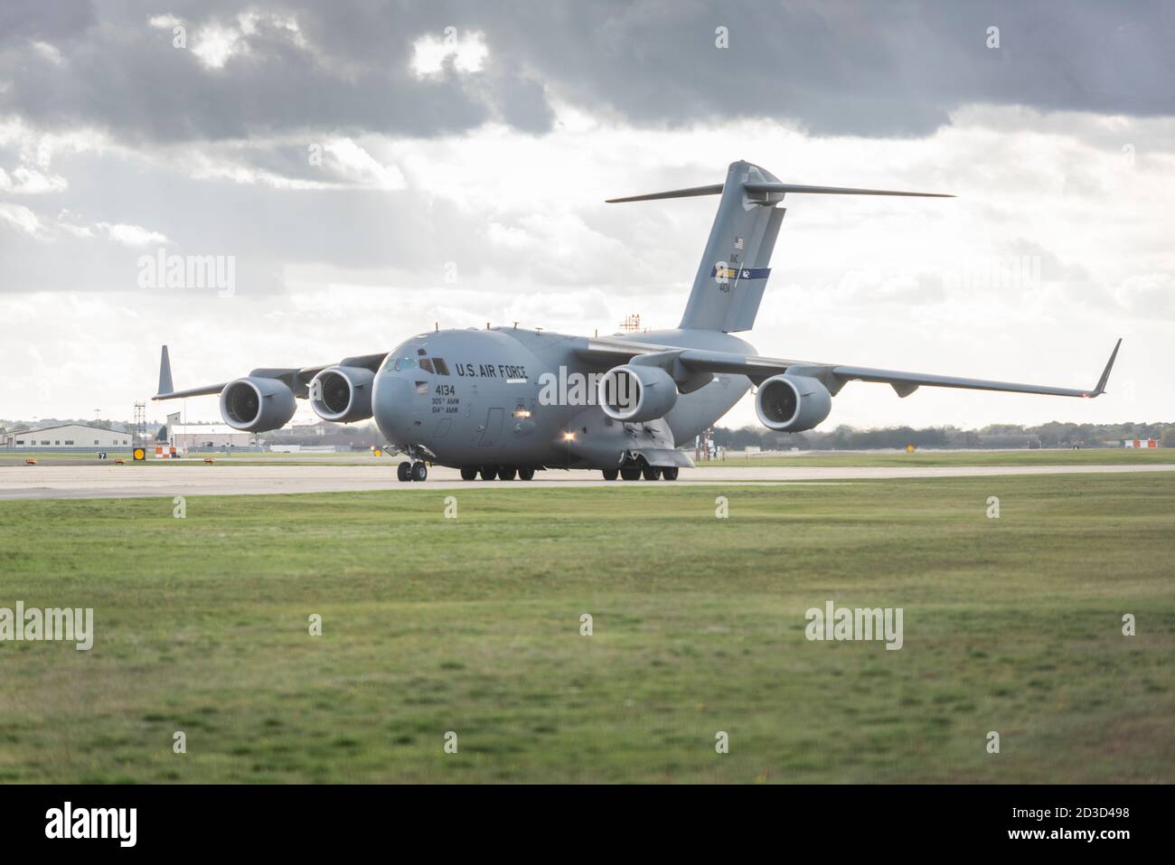 A USAF US Air Force C17 globetrotter transport plane taxiing on the runway at RAF Lakenhealth UK Stock Photo