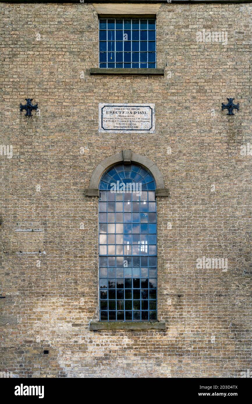 A sign on the wall at Stretham Old Engine, and old steam pumping station in the Fens at Stretham Cambridgeshire UK Stock Photo
