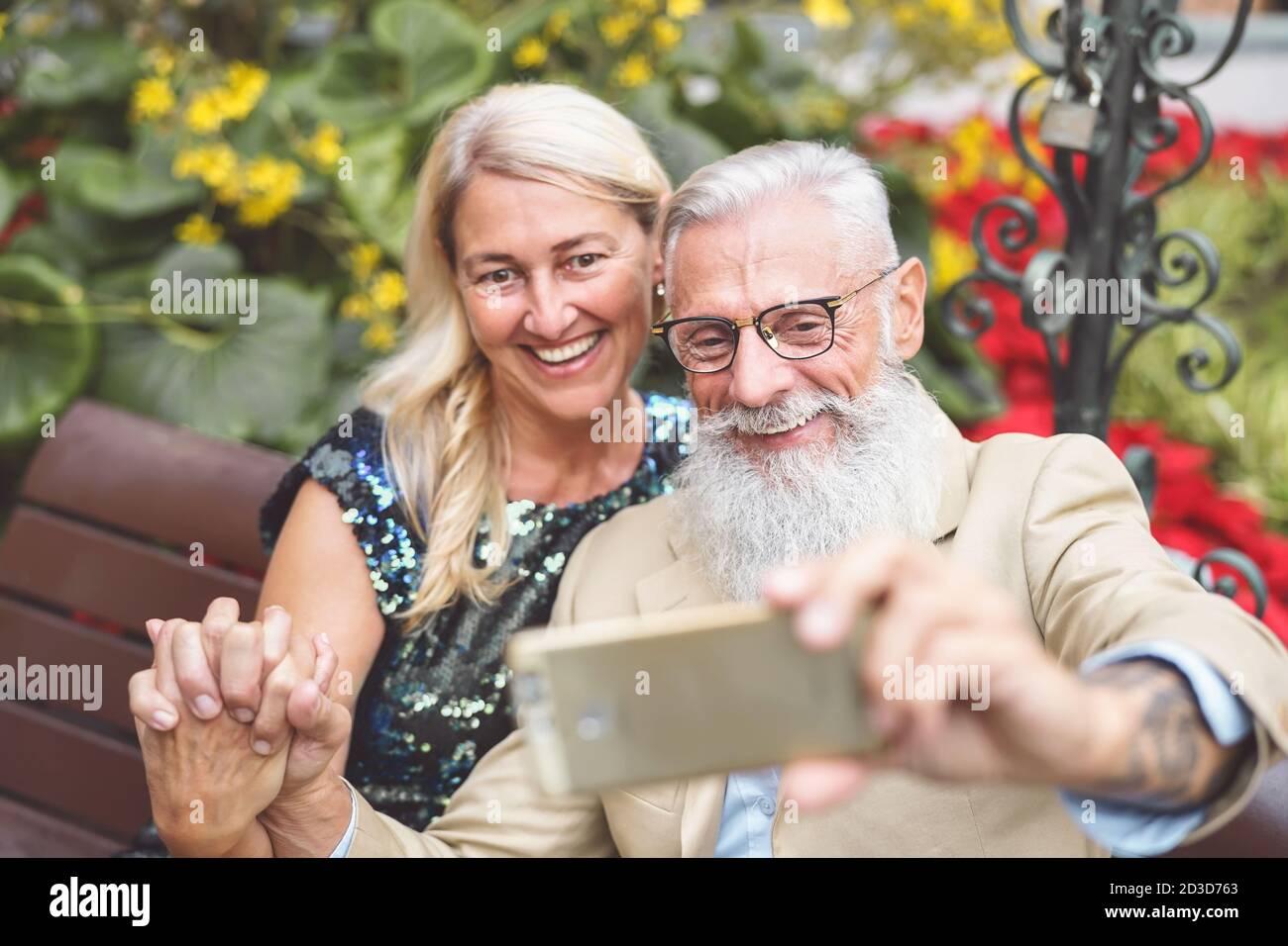 Happy senior couple taking selfie with mobile smart phone outdoor ...