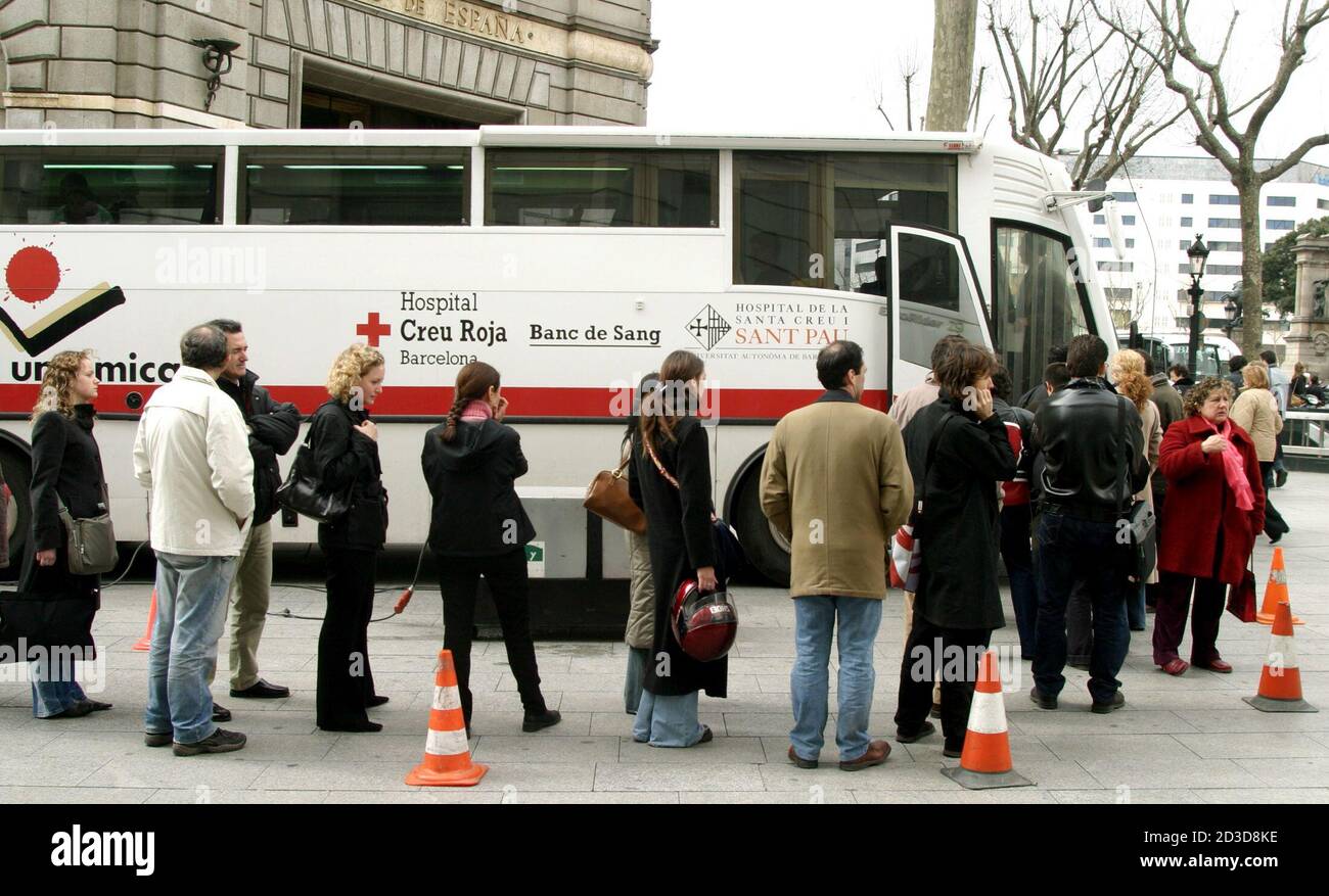 Barcelona's citizens line up in front a "Red Cross" bus to give blood in  aid for the victims of the Madrid bombings in central Barcelona. A series  of explosions that ripped through