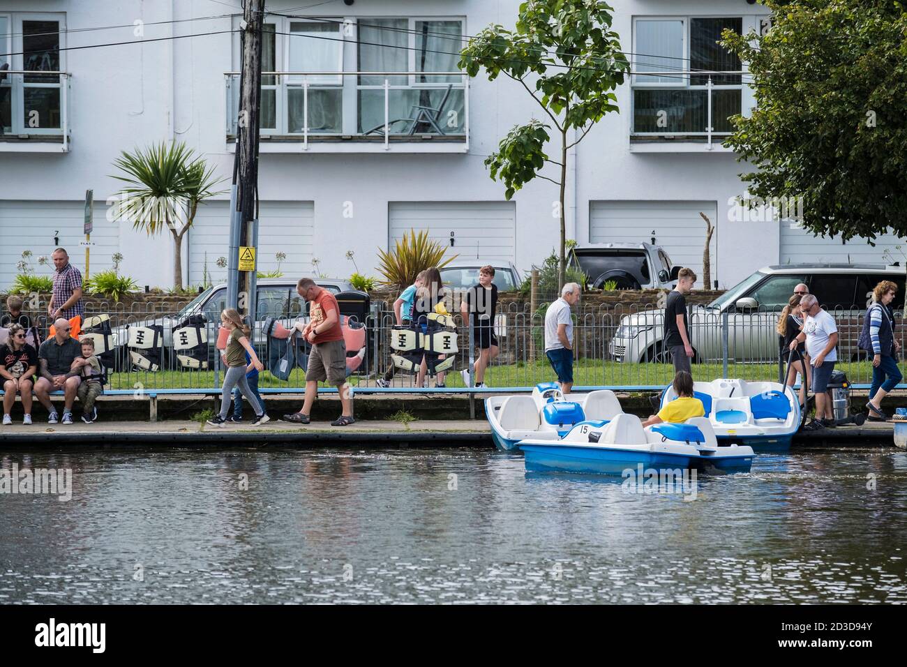 Holidaymakers hiring pedolos on Trenance Boating lake in Newquay in Cornwall. Stock Photo