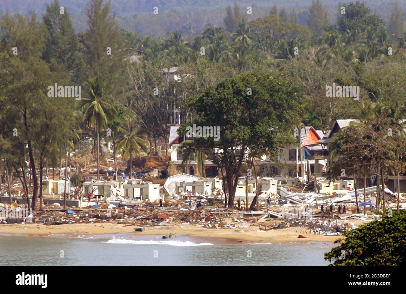 Rescue workers search for bodies in the wreckage a tourist resort in Khao  Lak, nearly 115 km north of the Thai resort island of Phuket December 29,  2004. The tsunami which ripped