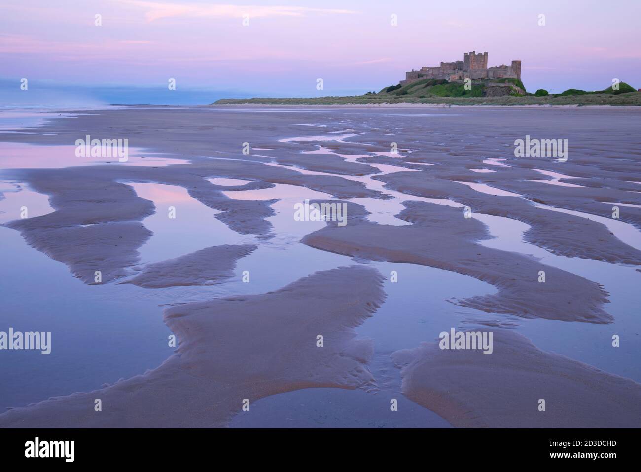 Bamburgh Castle from Bamburgh beach, Bamburgh, Northumberland. Summer (July 2019) Stock Photo