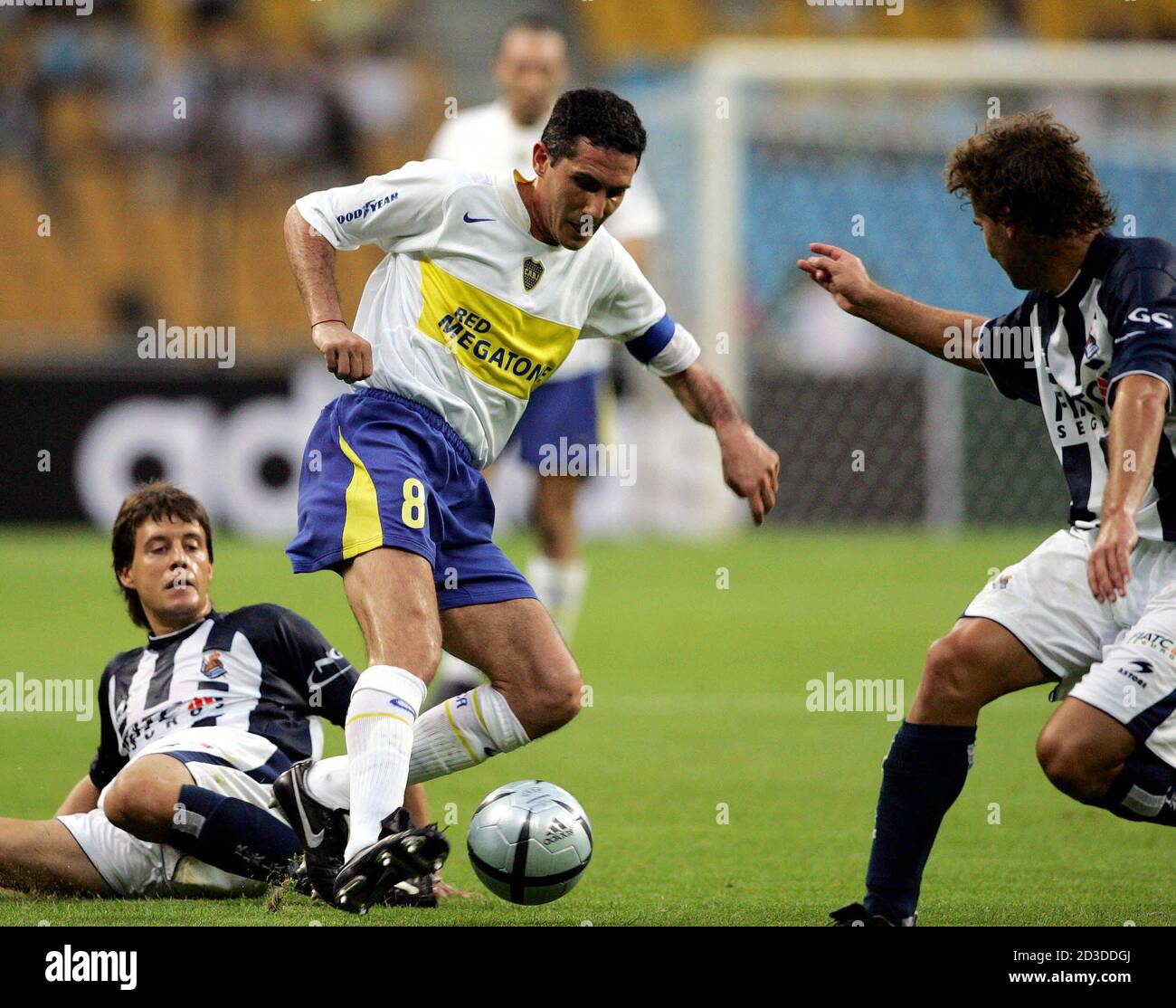 Argentine Club Boca Juniors Cagna Diego C Is Challenged By Spanish Club Real Sociedad S Mikel Aranburu L And Fabiano Adriano Rossato During Their Peace Cup Soccer Match In Pusan About 4 Km Argentine Club Boca Juniors Cagna Diego C Is Challenged By Spanish Club Real Sociedad S Mikel Aranburu L And Fabiano Adriano Rossato During Their Peace Cup Soccer Match In Pusan About 4 Km