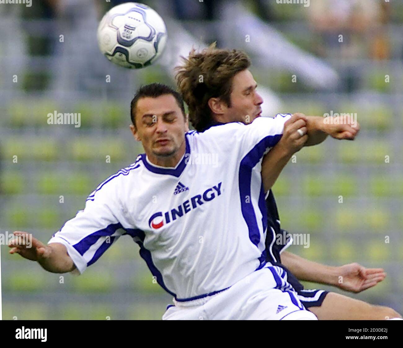 Harald Cerny (R) of TSV 1860 Munich is challenged by Vladimir Kinder of FK Drnovice during the first half of their Uefa Cup soccer match in Munich's Olympic stadium, September 26, 2000.  MAD Stock Photo