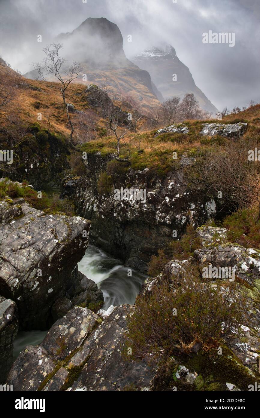 View to the Three Sisters of Glencoe from the meeting of three waters, Glencoe, Lochaber, Scottish Highlands, Scotland. Winter (December 2019) Stock Photo