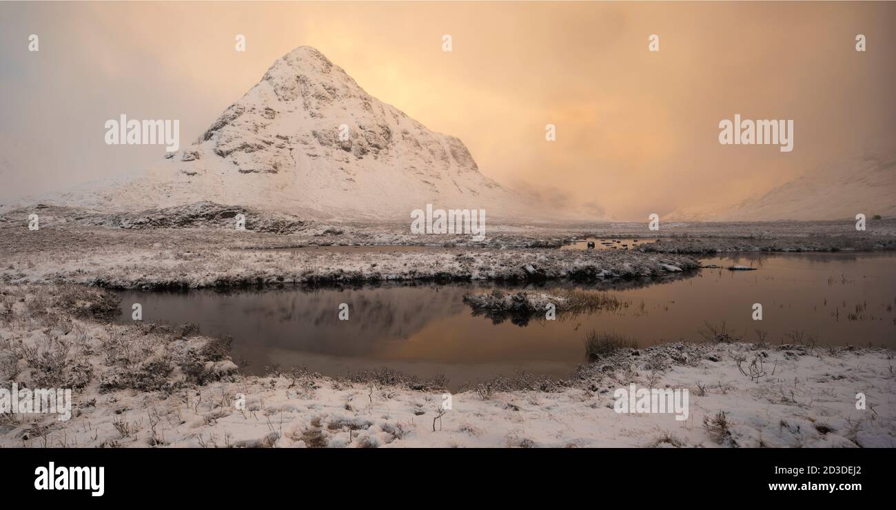 Lochan-na-fola and snow covered Bauchaille etive beag, Glencoe, Lochaber, Scottish Highlands. Winter (February 2020) Stock Photo