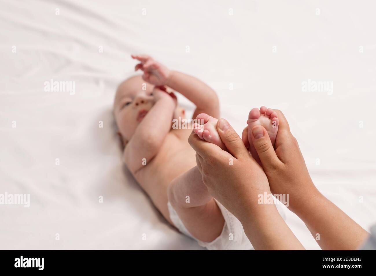 baby foot massage, closeup of hands and foot of baby Stock Photo Alamy