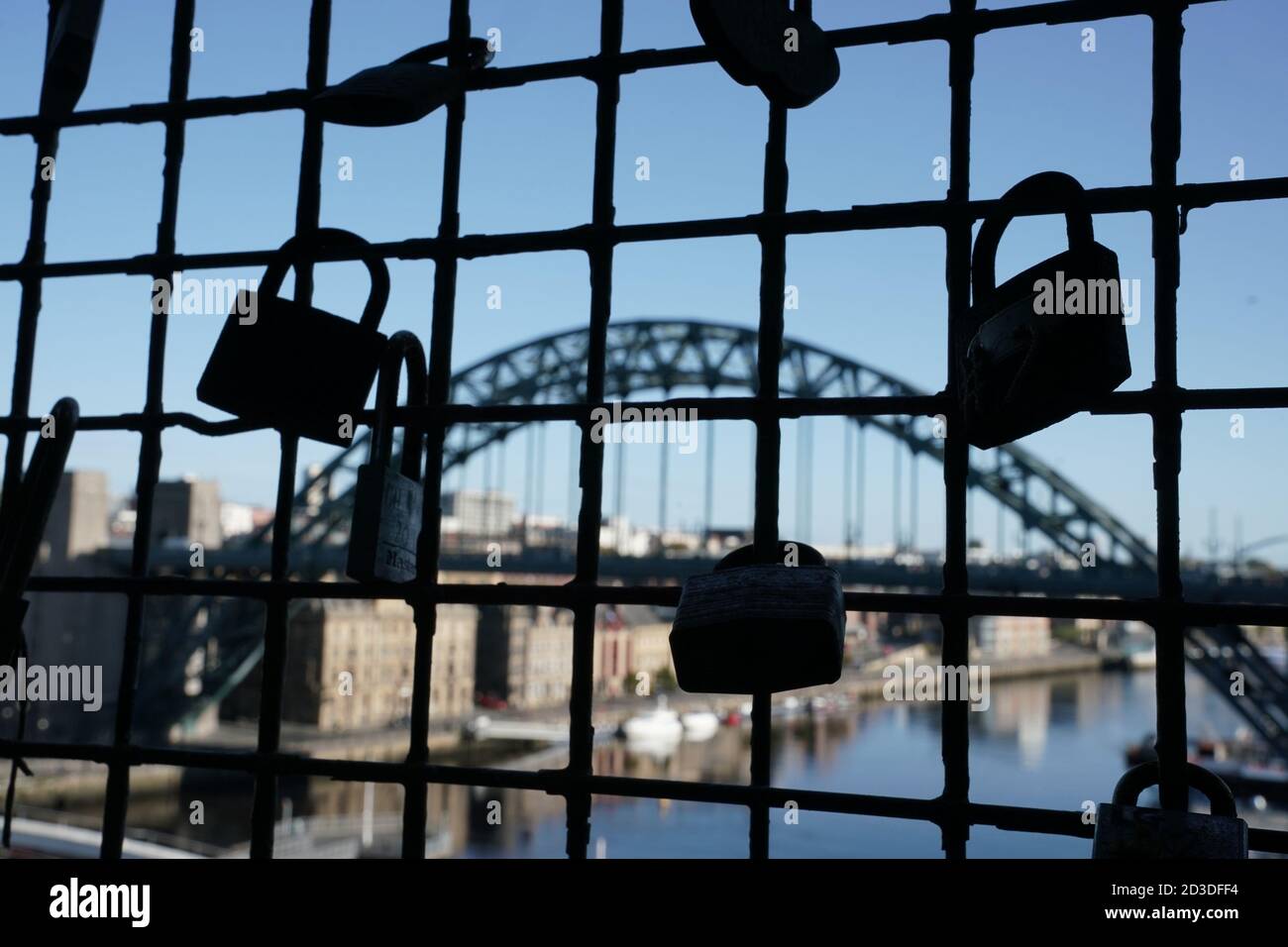 Padlocks on a bridge over the River Tyne in Newcastle. Ministers are considering imposing fresh regional restrictions amid a spike in coronavirus cases in northern England. Stock Photo