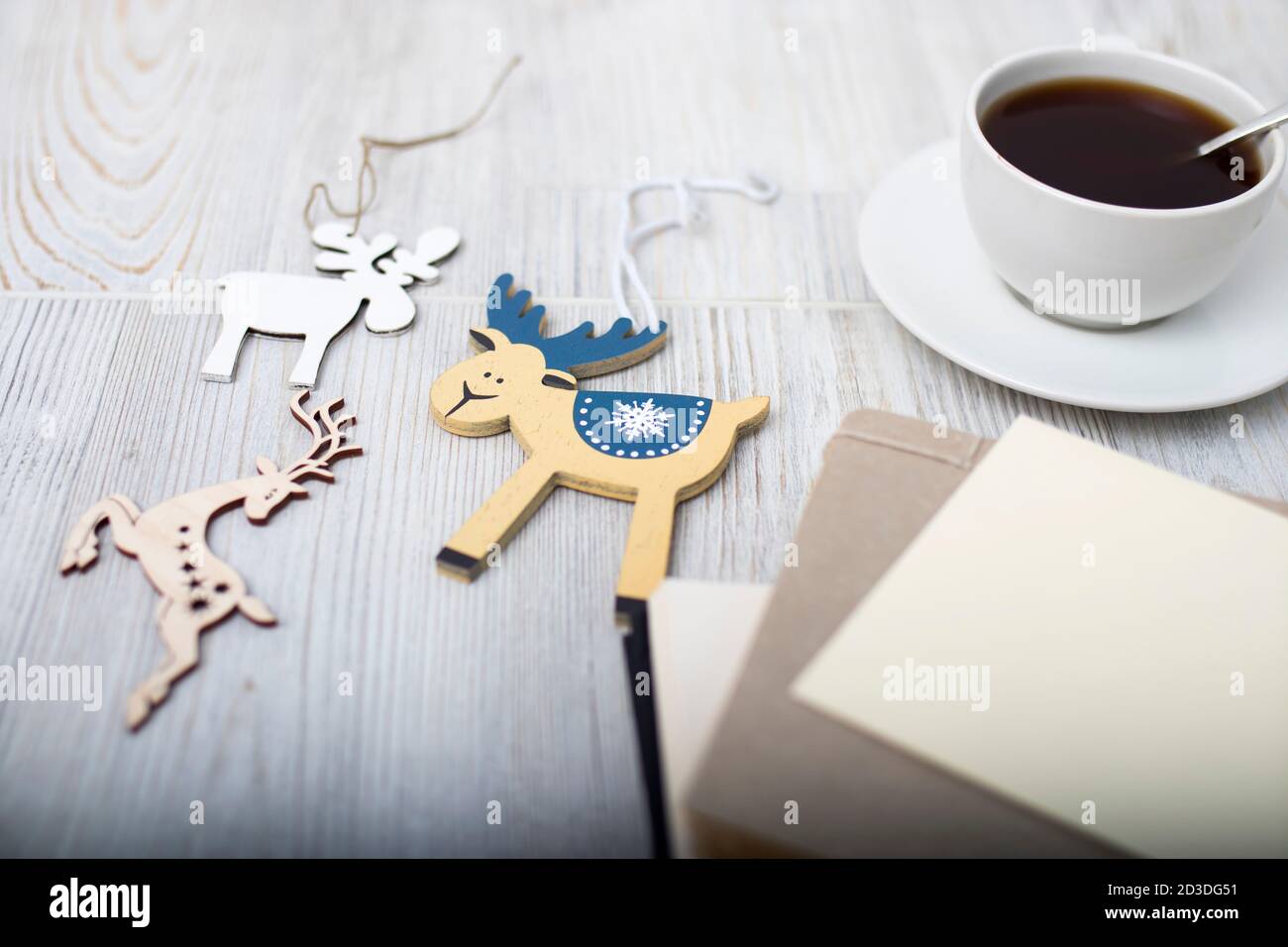 A porcelain cup with coffee on a long empty table. Space for text. Stock Photo