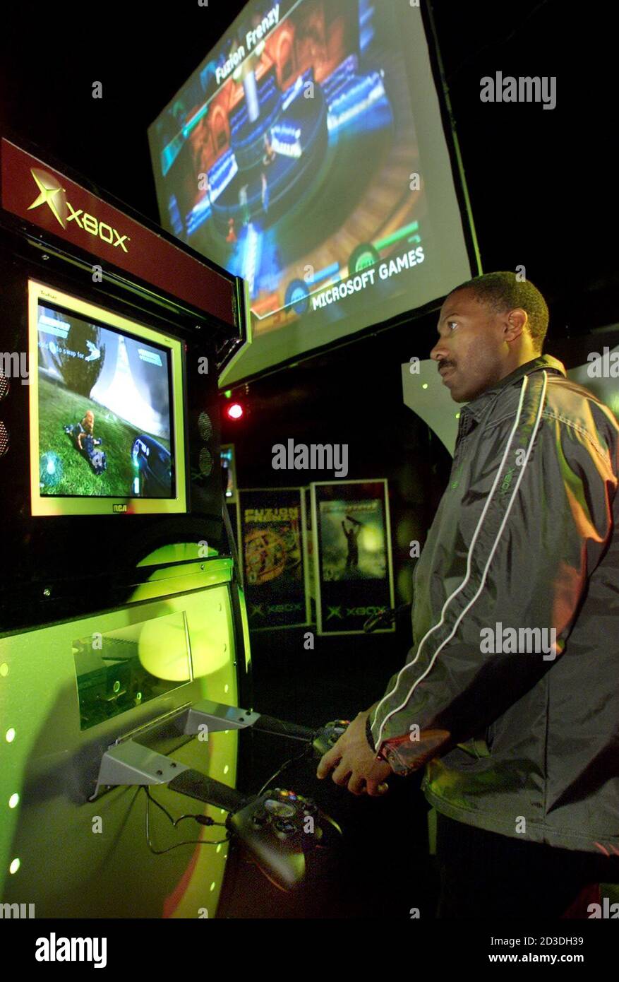 Rome Reddick plays at a Microsoft XBOX video game console at the XBOX  Odyssey media preview in Seattle, Washington, October 26, 2001. The much  anticipated XBOX video game system, which rivals Sony's