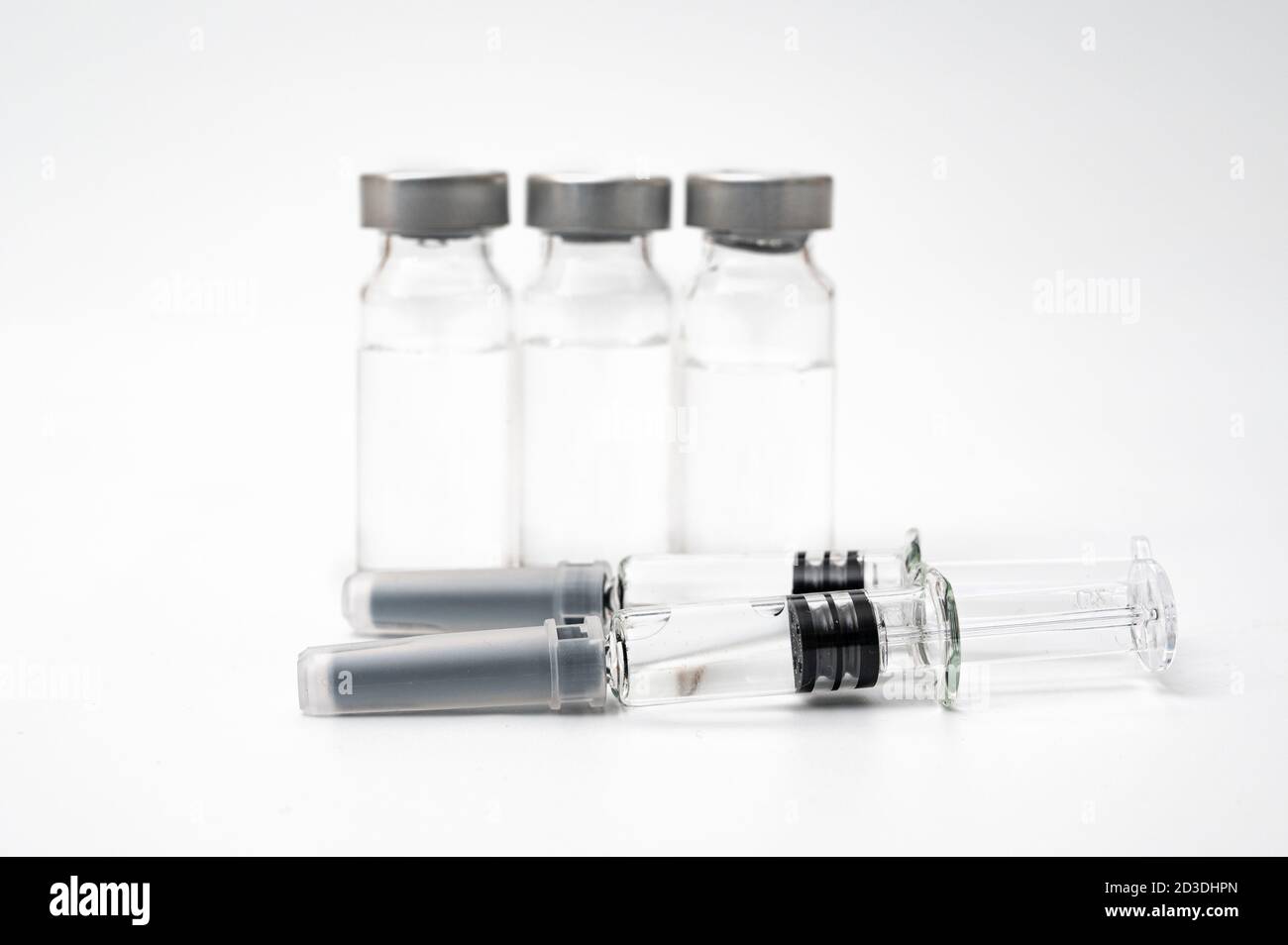 Vaccine concept with syringe and vial on a white background. Stock Photo