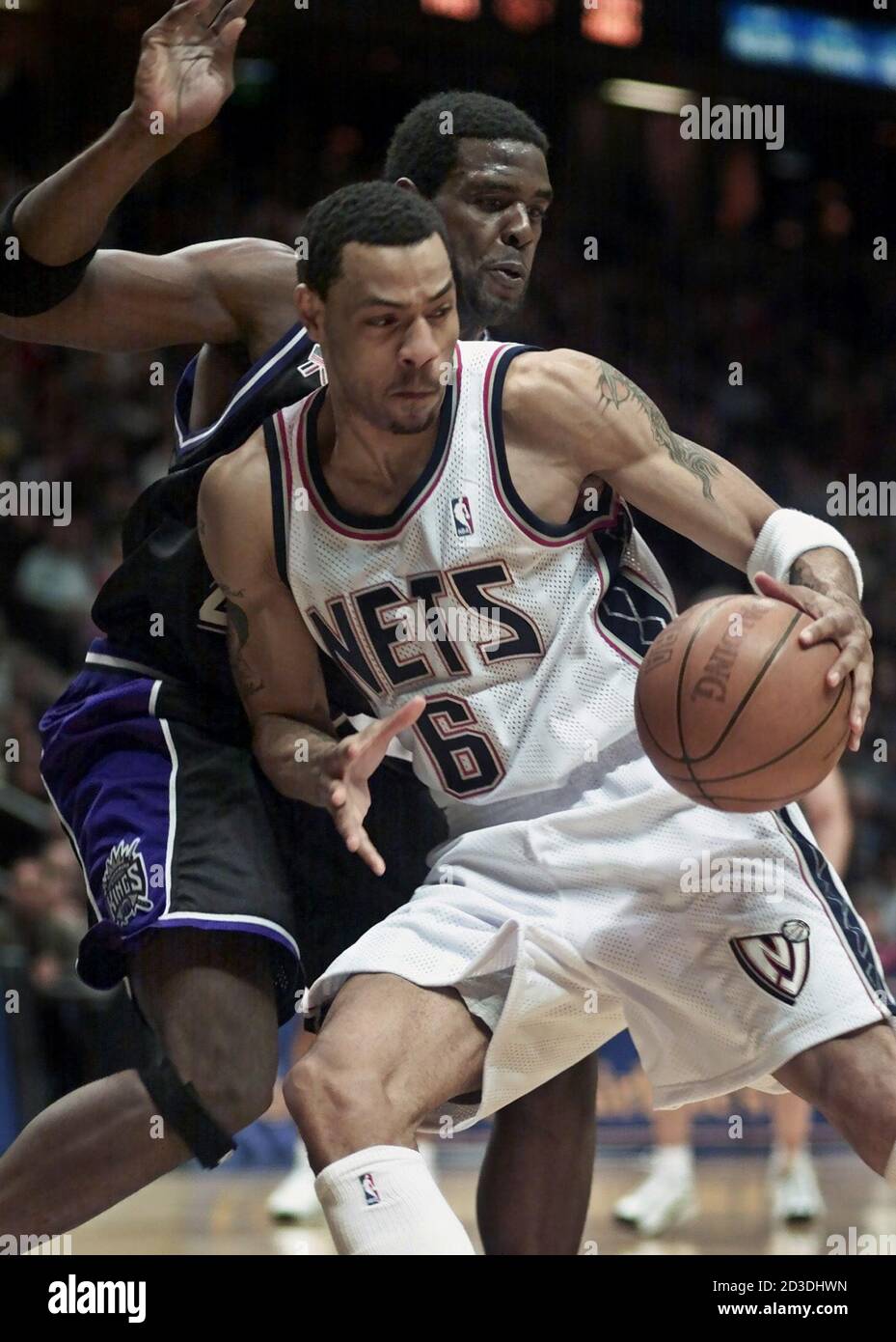 New Jersey Nets forward Kenyon Marton (6) tries to move the ball around  Sacramento Kings forward Chris Webber in the first quarter of their NBA  game, February 4, 2002 at the Continental