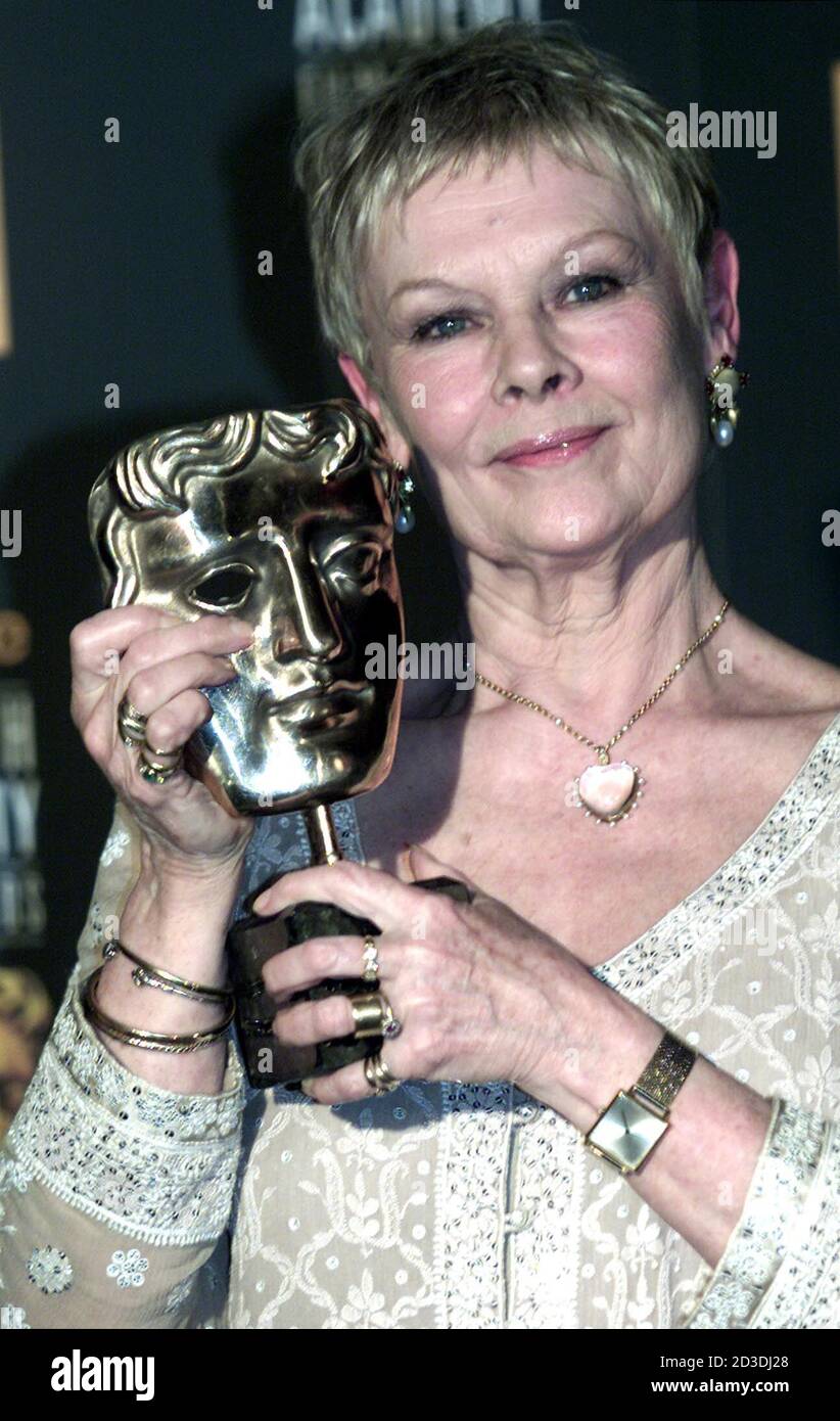 British actress Dame Judi Dench receives the British Academy best actress award for playing another damaged genius with her memorable portrayal of writer Iris Murdoch 'sliding into the darkness' with Alzheimer's Disease in the poignant 'Iris'. Stock Photo