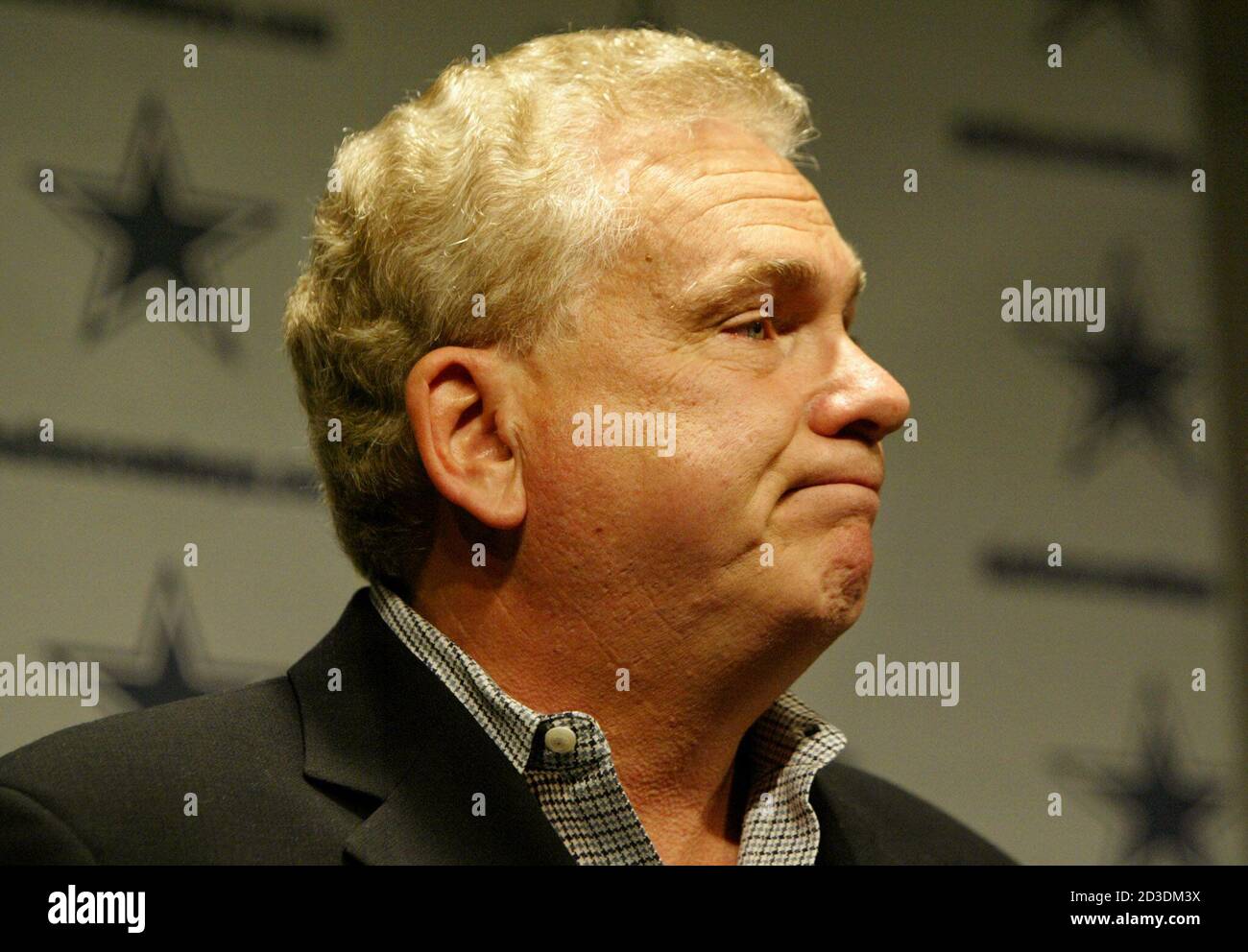 Former Dallas Cowboys head coach Dave Campo reacts during a press  conference December 30, 2002 after being fired by team owner Jerry Jones at  the team's practice headquarters in Irving, Texas. Campo