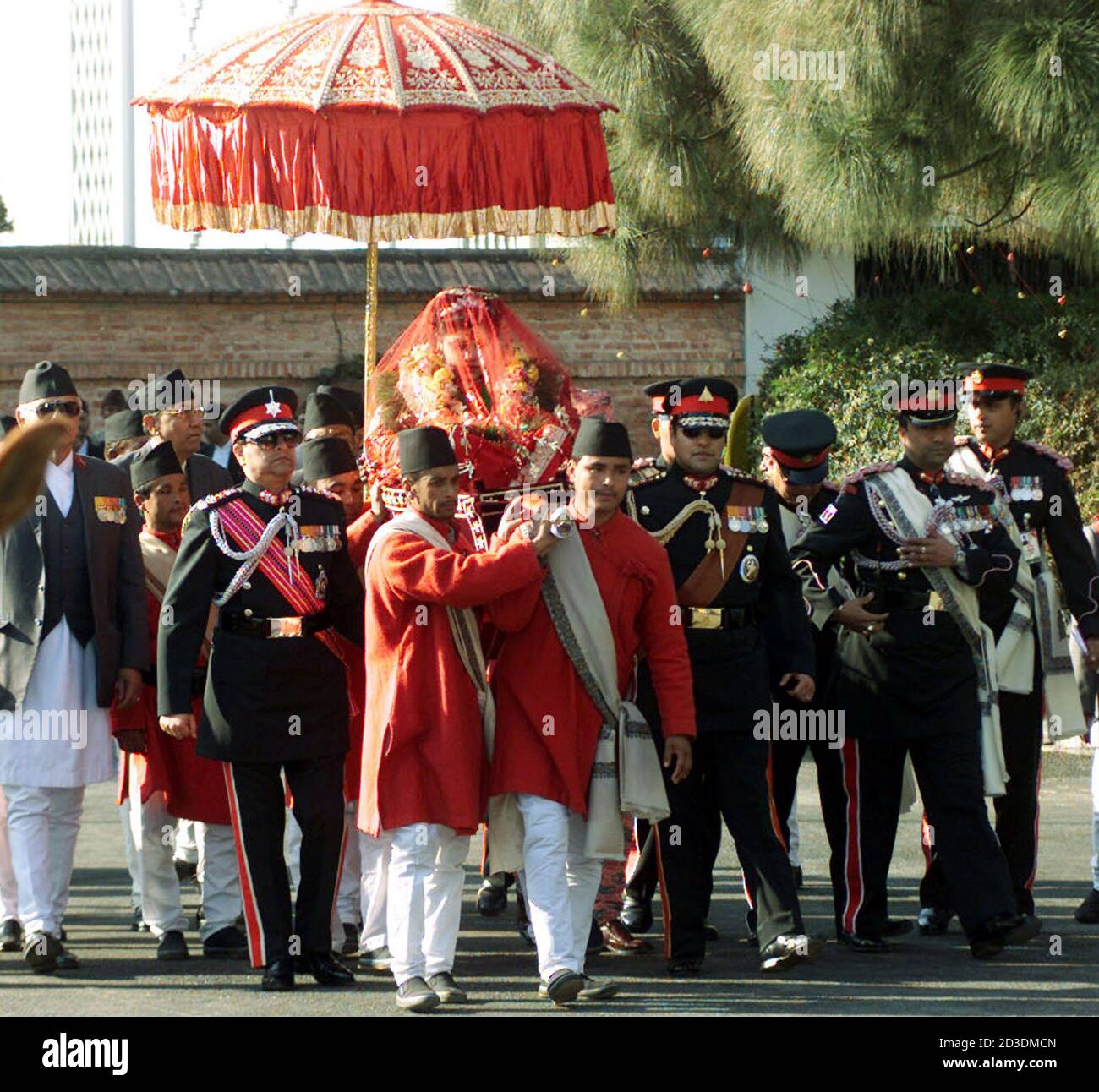 King Gyanendra (2nd L) and Crown Prince Parash (4th R) send off Princess  Prerna, carried on a traditional "doli", during the wedding ceremony at  Narayanhiti royal palace in Kathmandu January 23, 2003. [