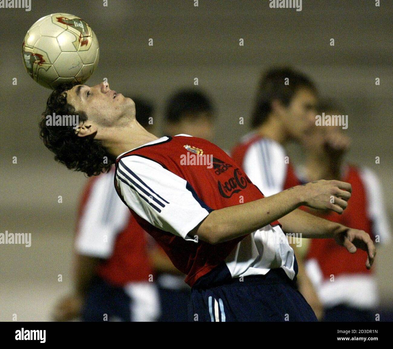 Argentina's under 20 soccer team player Gonzalo Rodriguez heads the ball  during a training session at Al Shaab Sports Club in Sharjah, November 27,  2003. Argentina will face Spain on November 28