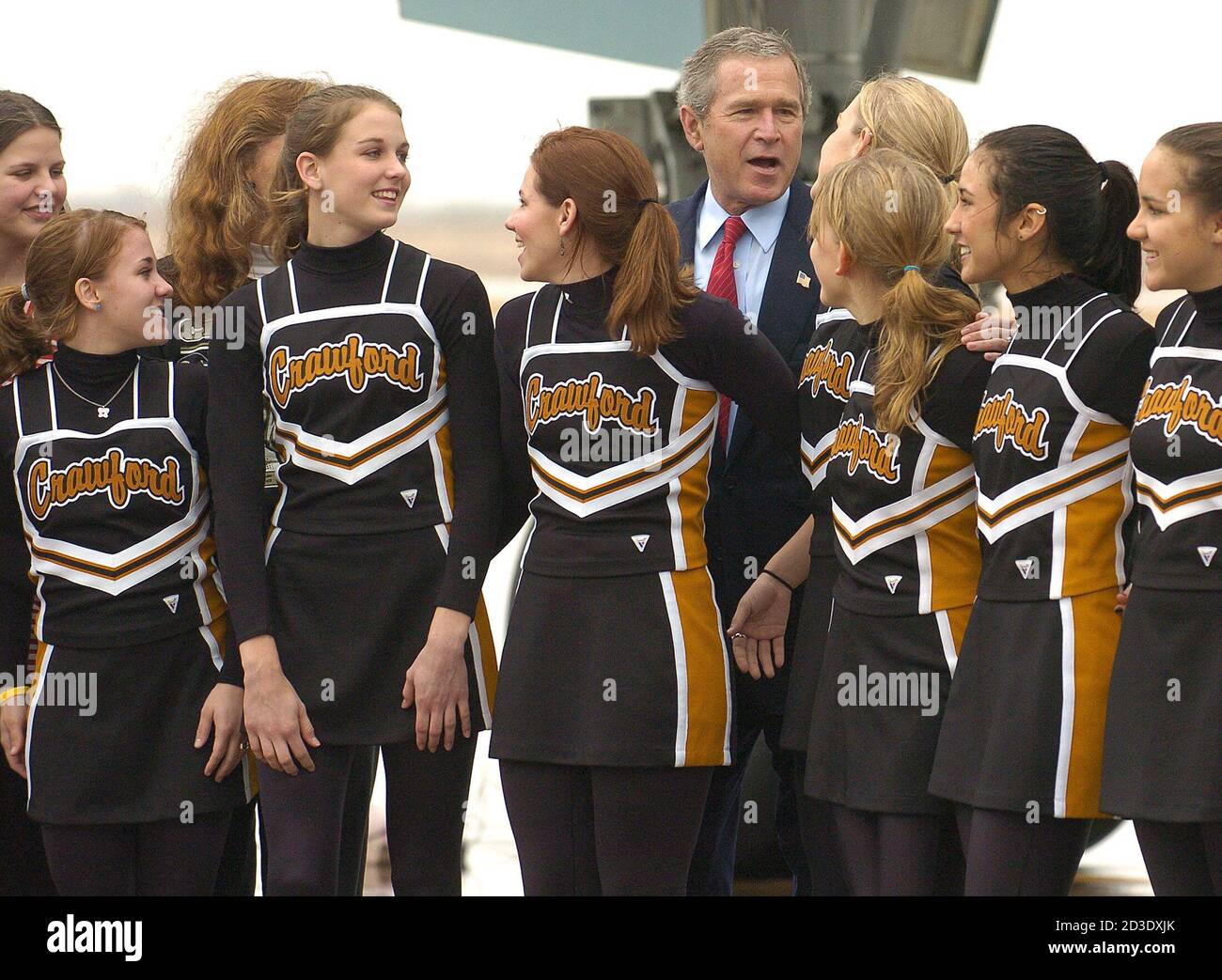 U.S. President George W. Bush chats with cheerleaders from 