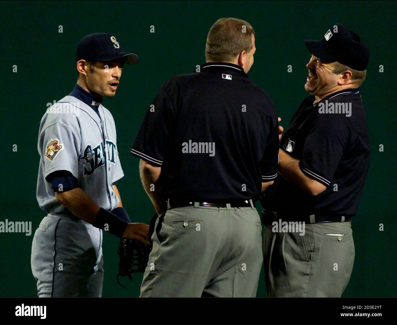 Seattle Mariners star right fielder Ichiro Suzuki (L) jokes with first