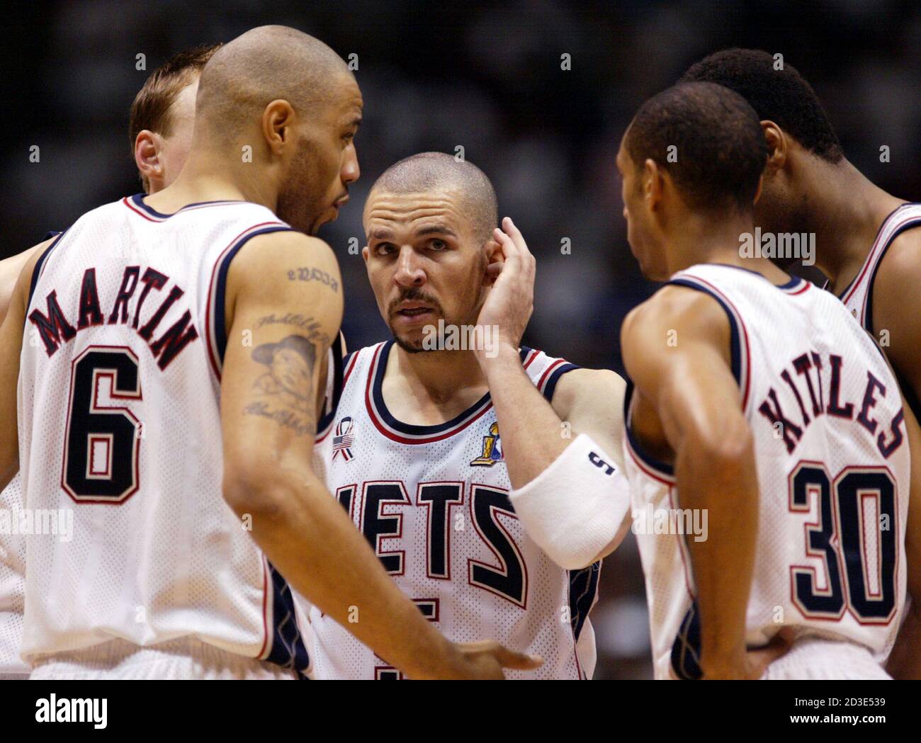 New Jersey Nets guard Jason Kidd (C) talks with his teammates in the  closing minutes of Game 3 of the NBA finals against the Los Angeles Lakers at  the Continental Airlines Arena