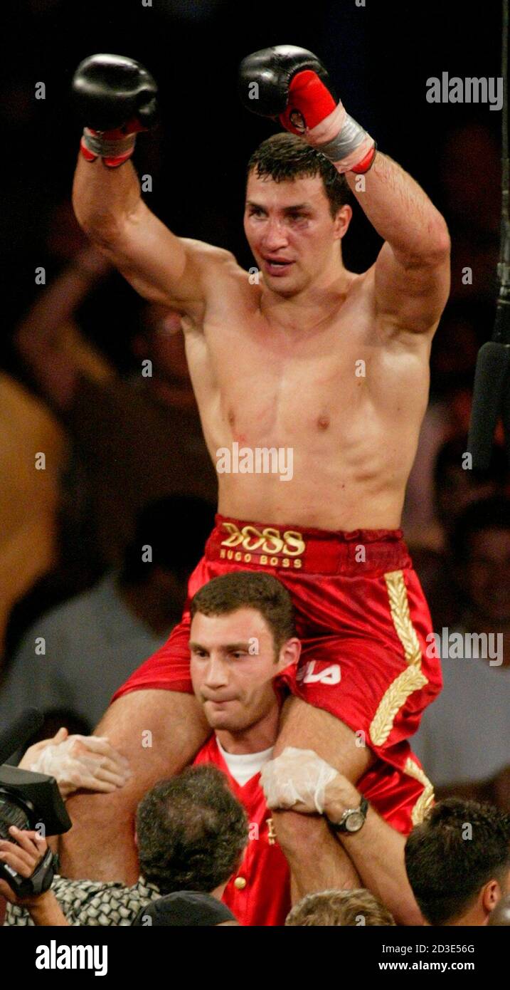 Ukrainian Vitale Klitschko holds his brother Vladimir on his shoulders  after he scored a TKO on American boxer Ray Mercer to win the WBO  heavyweight belt in a fight in Atlantic City,