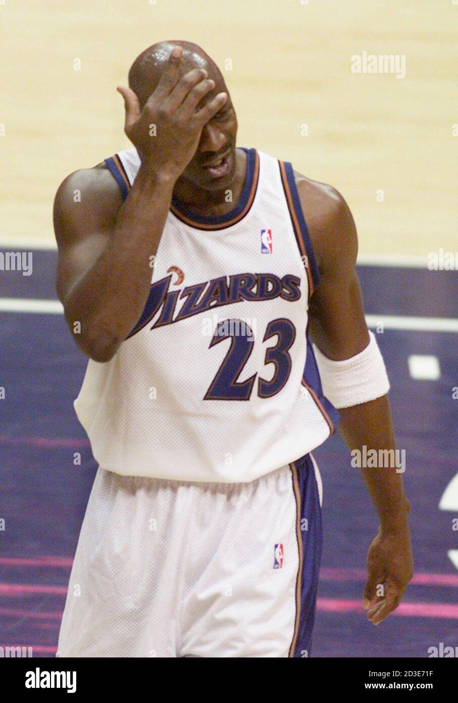 Washington Wizards' Michael Jordan puts his hand to his head after he  thought a foul should have been called on the Sacramento Kings' Doug  Christie during first quarter NBA action at the