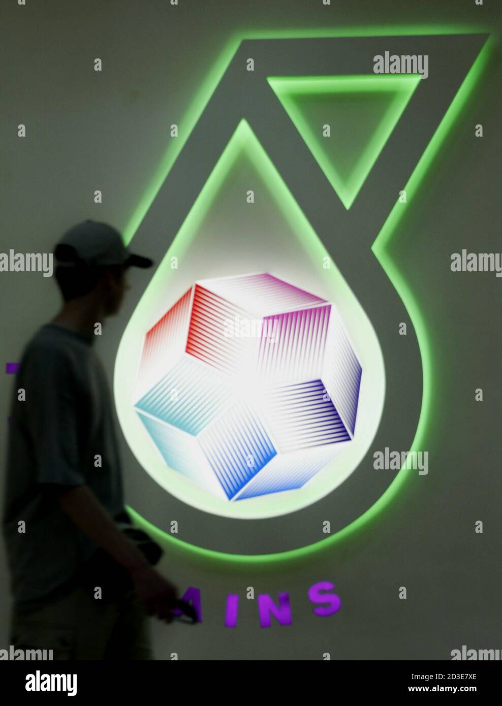 A Man Looks At The Petroliam Nasional Bhd Petronas Science Centre Logo As He Walks Past In Kuala Lumpur On June 30 2003 Petronas Malaysia S Largest Company Said On Monday Earnings Rose