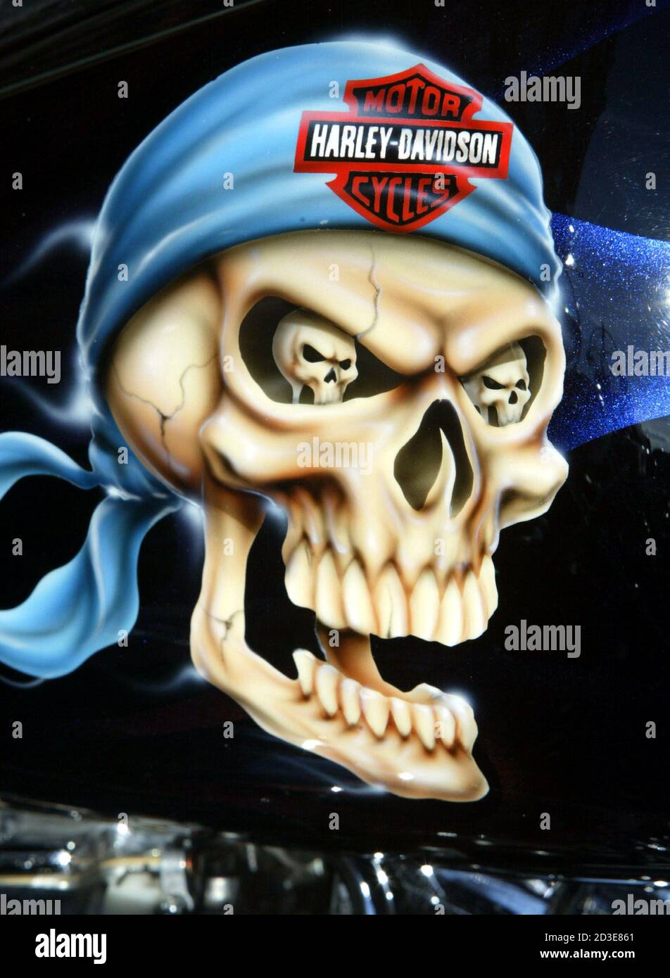 A skull graphic is painted on the gas tank of a Harley-Davidson motorcycle in downtown Milwaukee, August 30, 2003. The legendary American motorcycle company is celebrating its 100th anniversary. Stock Photo