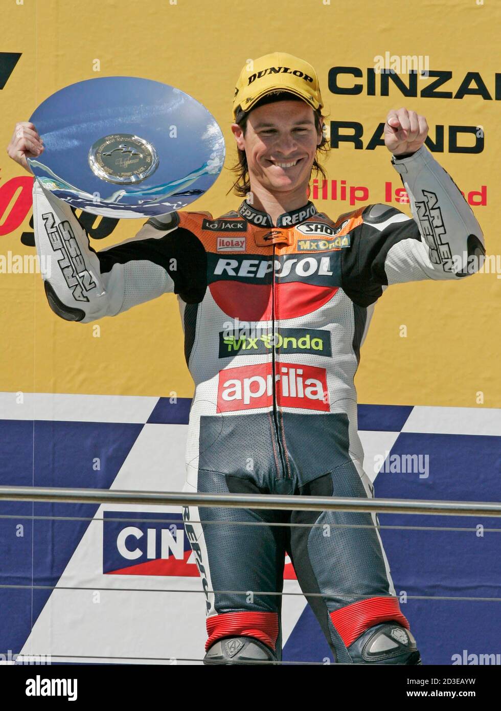 Argentine 250cc Sebastian Porto celebrates on the podium at the Australian  Motorcycling Grand Prix in Philip Island October 17, 2004. Porto lead the  from start to win the 250cc race at the